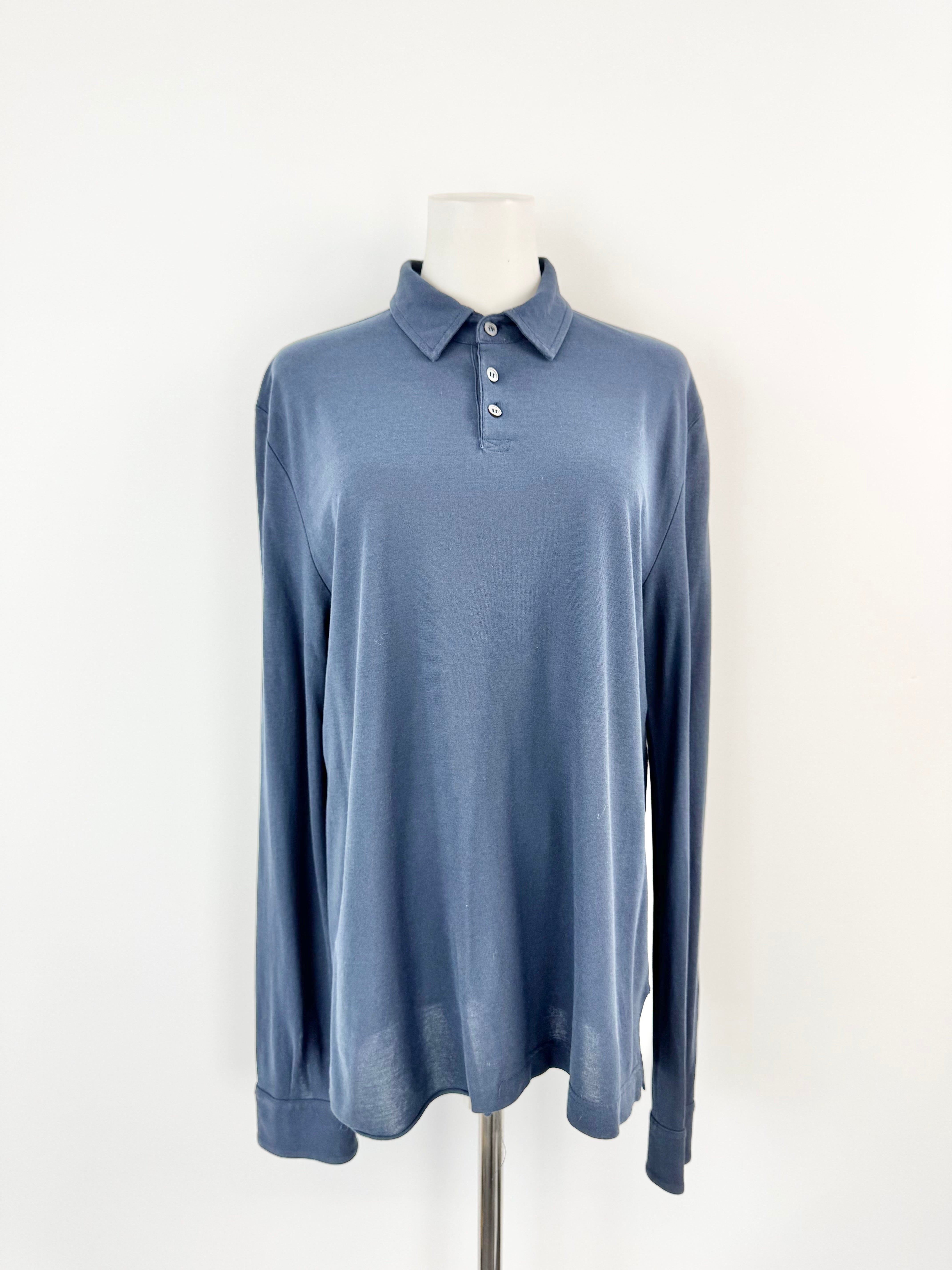 Blue long-sleeve polo shirt on a mannequin against a white background