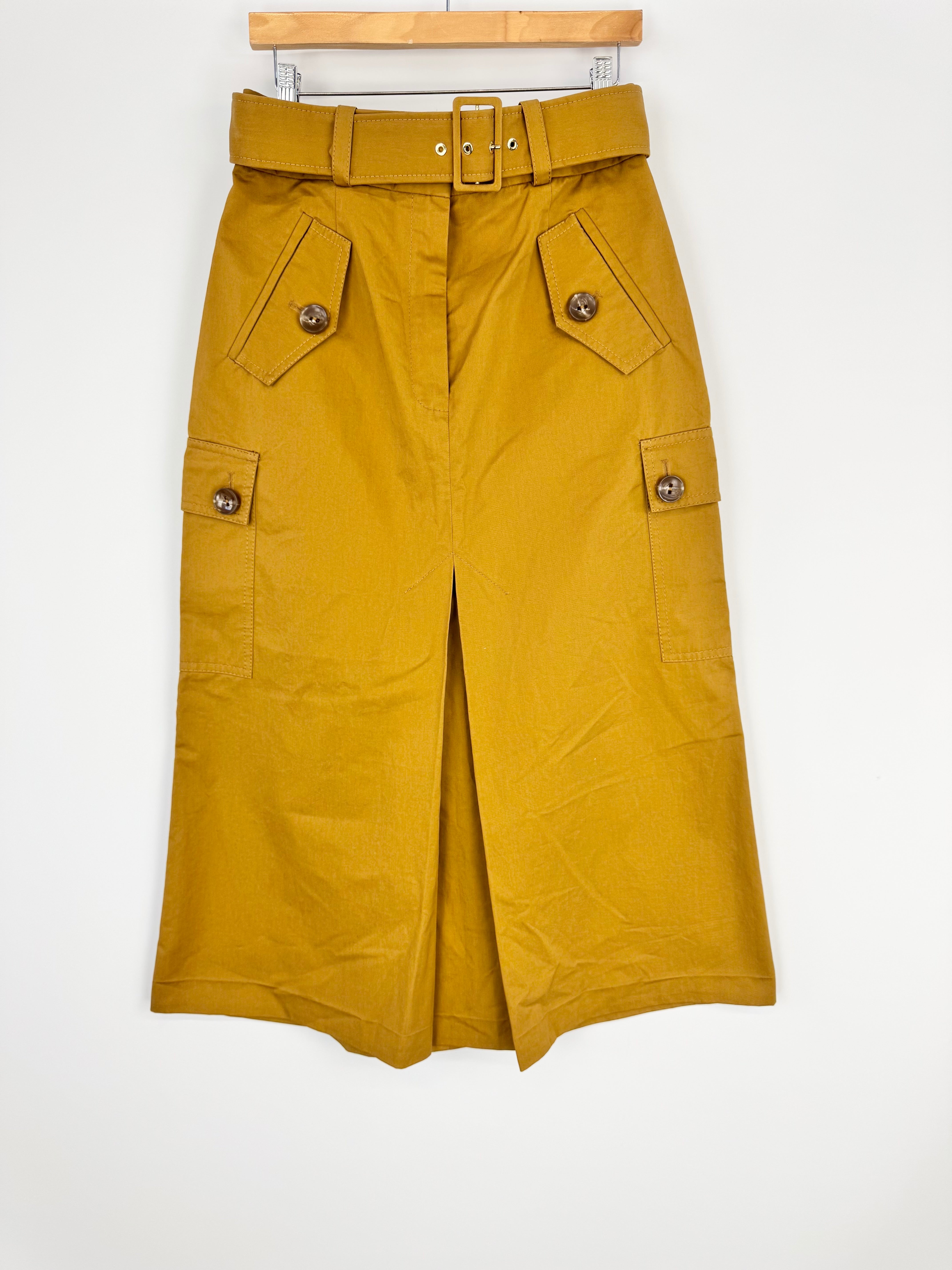 Mustard yellow skirt with belt on a white background