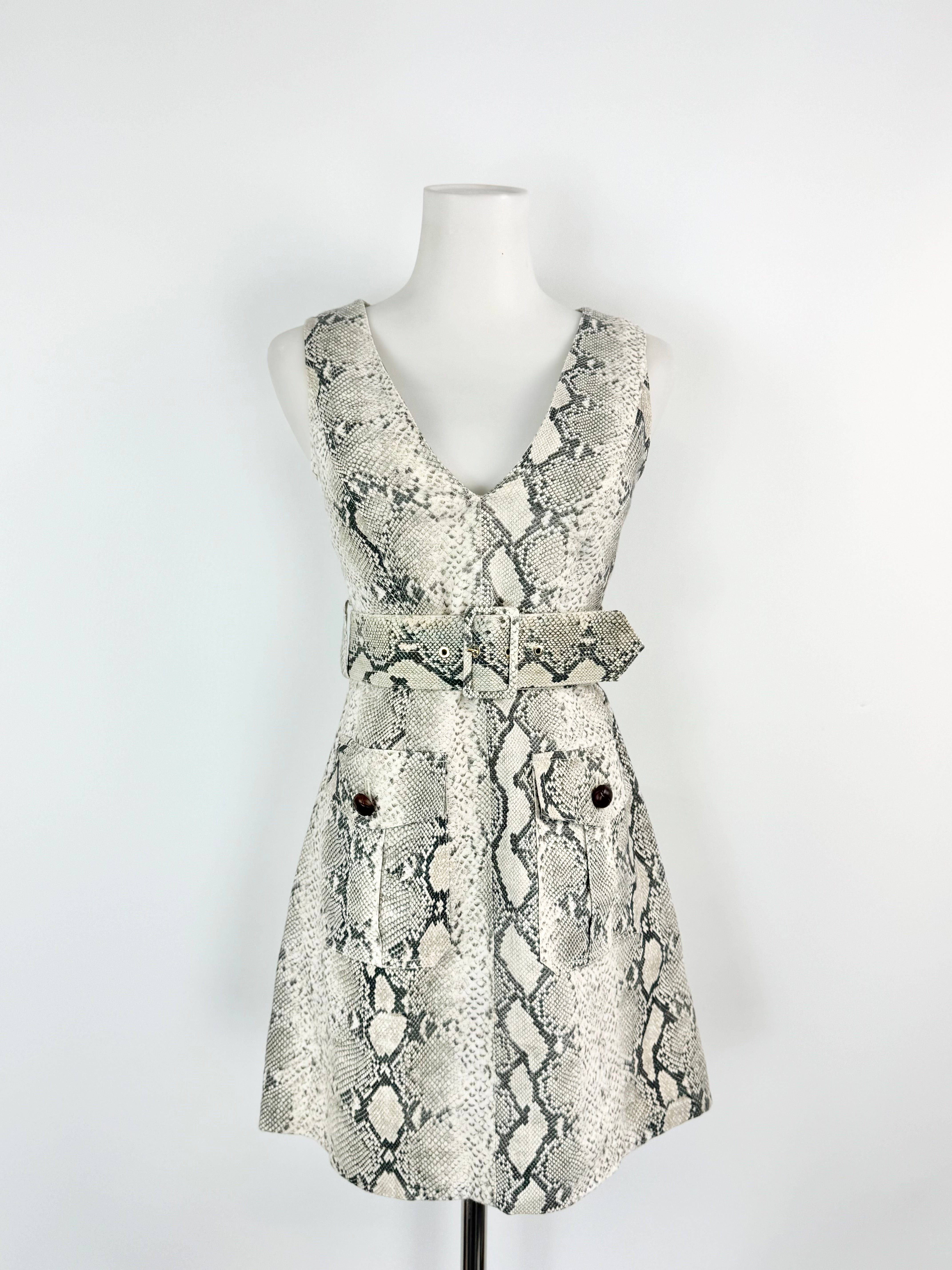 Snake print dress on a mannequin against a white background