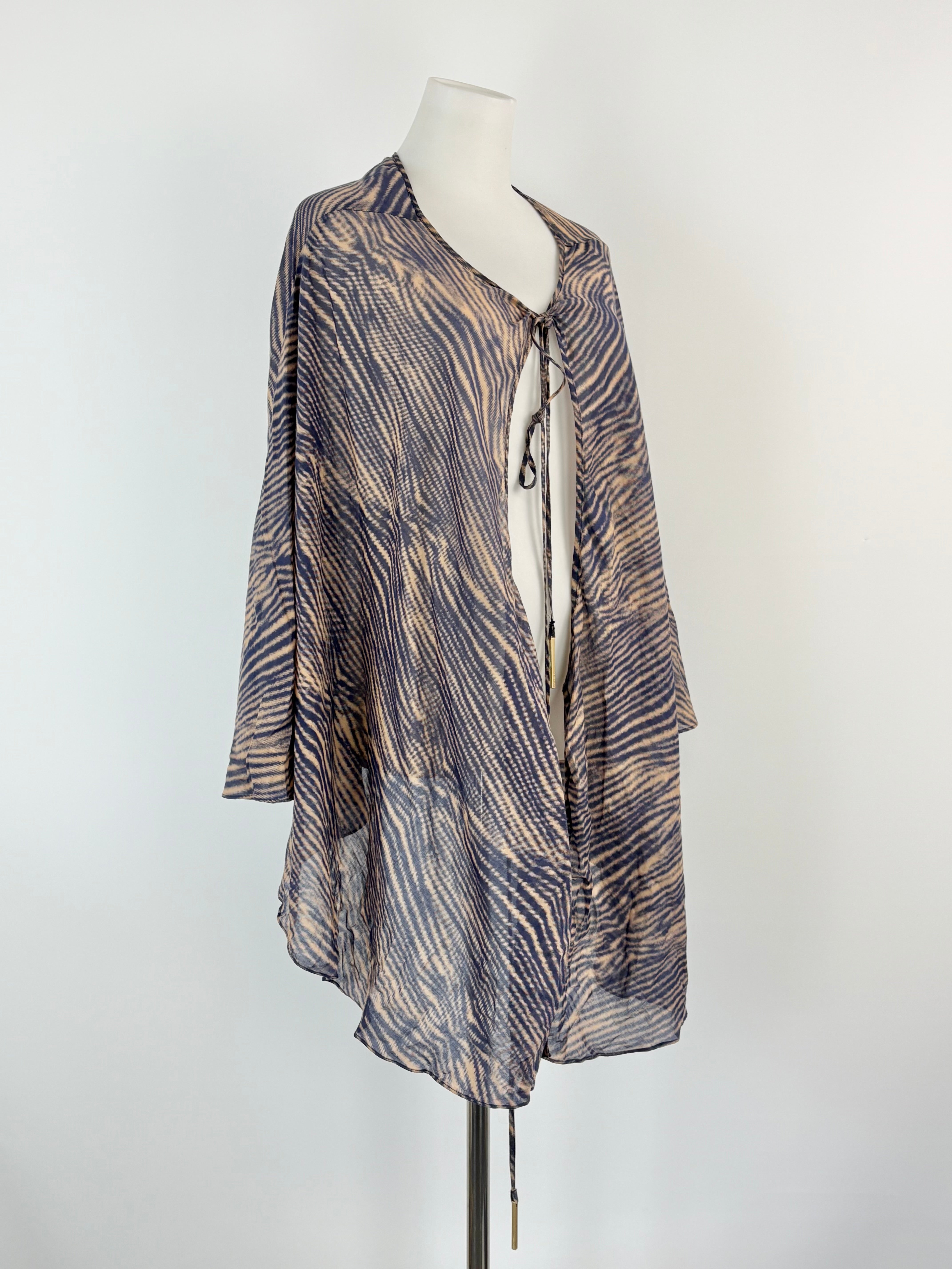 Zebra print jacket on a mannequin against a white background