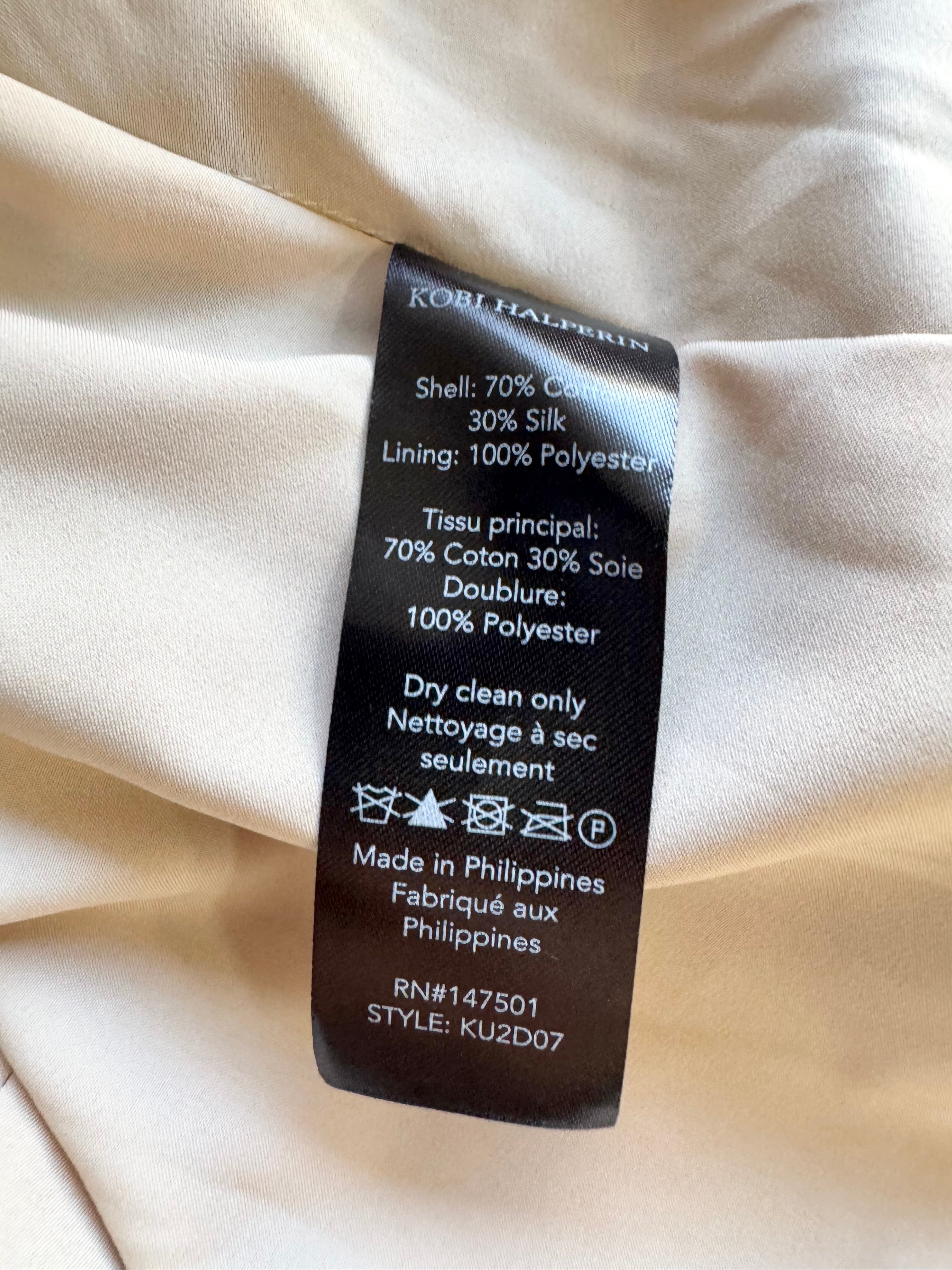 Clothing label on a beige fabric background
