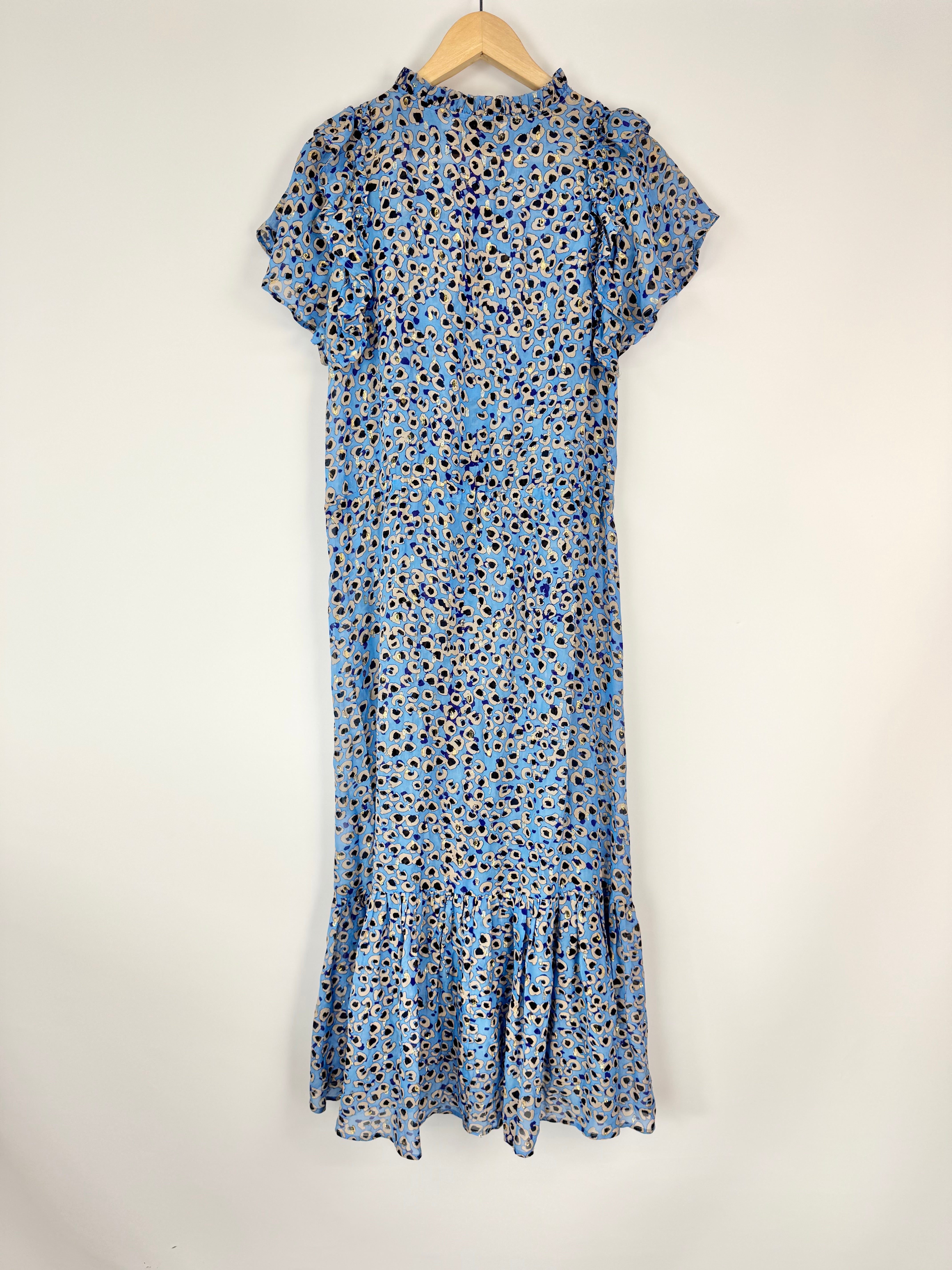 Blue dress with a leopard print pattern on a hanger against a white background