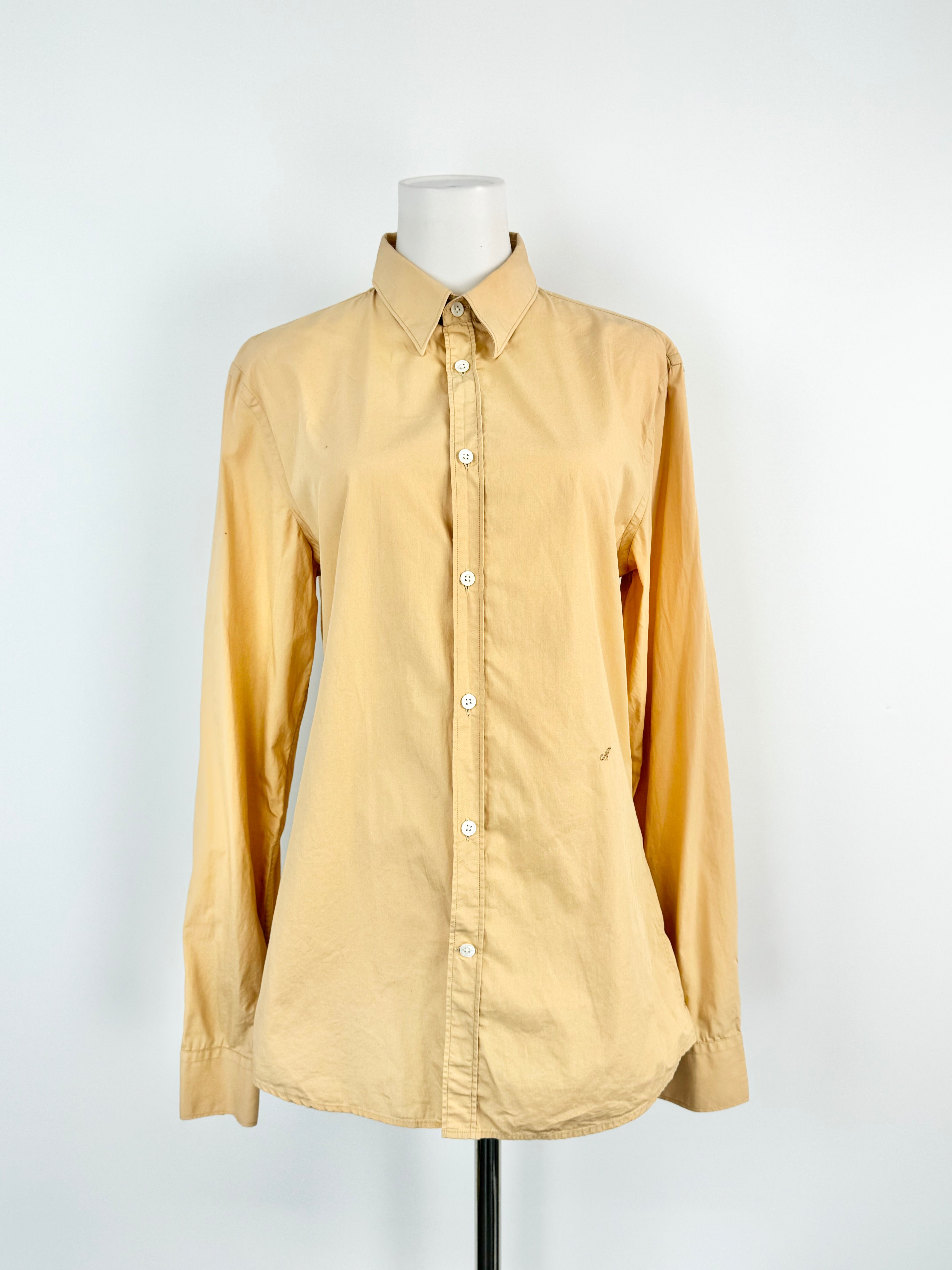 Pale orange shaded cotton shirt by Acne, displayed on a mannequin, with long sleeves and a classic collar.