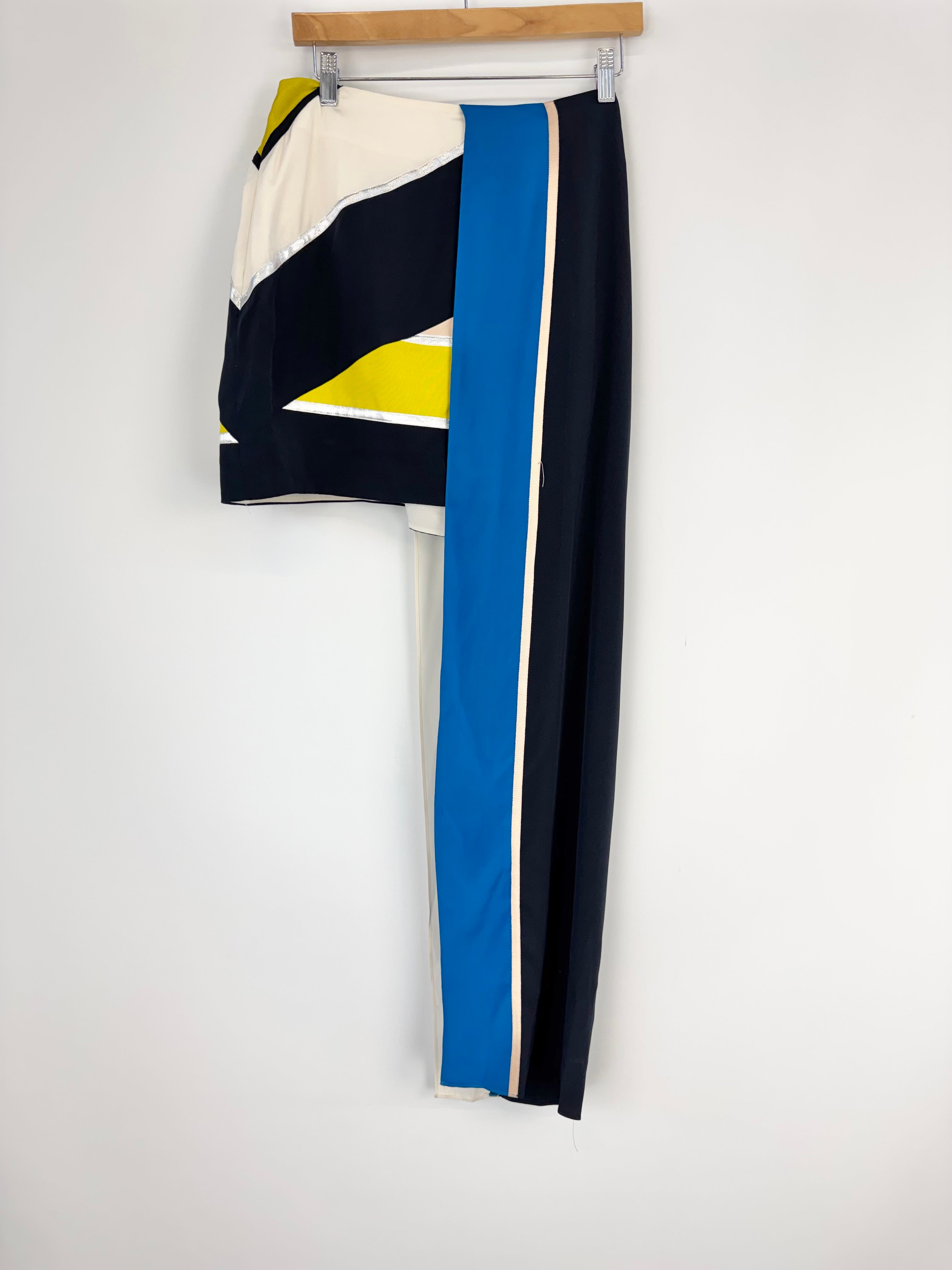 Color-blocked pants with black, blue, and yellow on a white background
