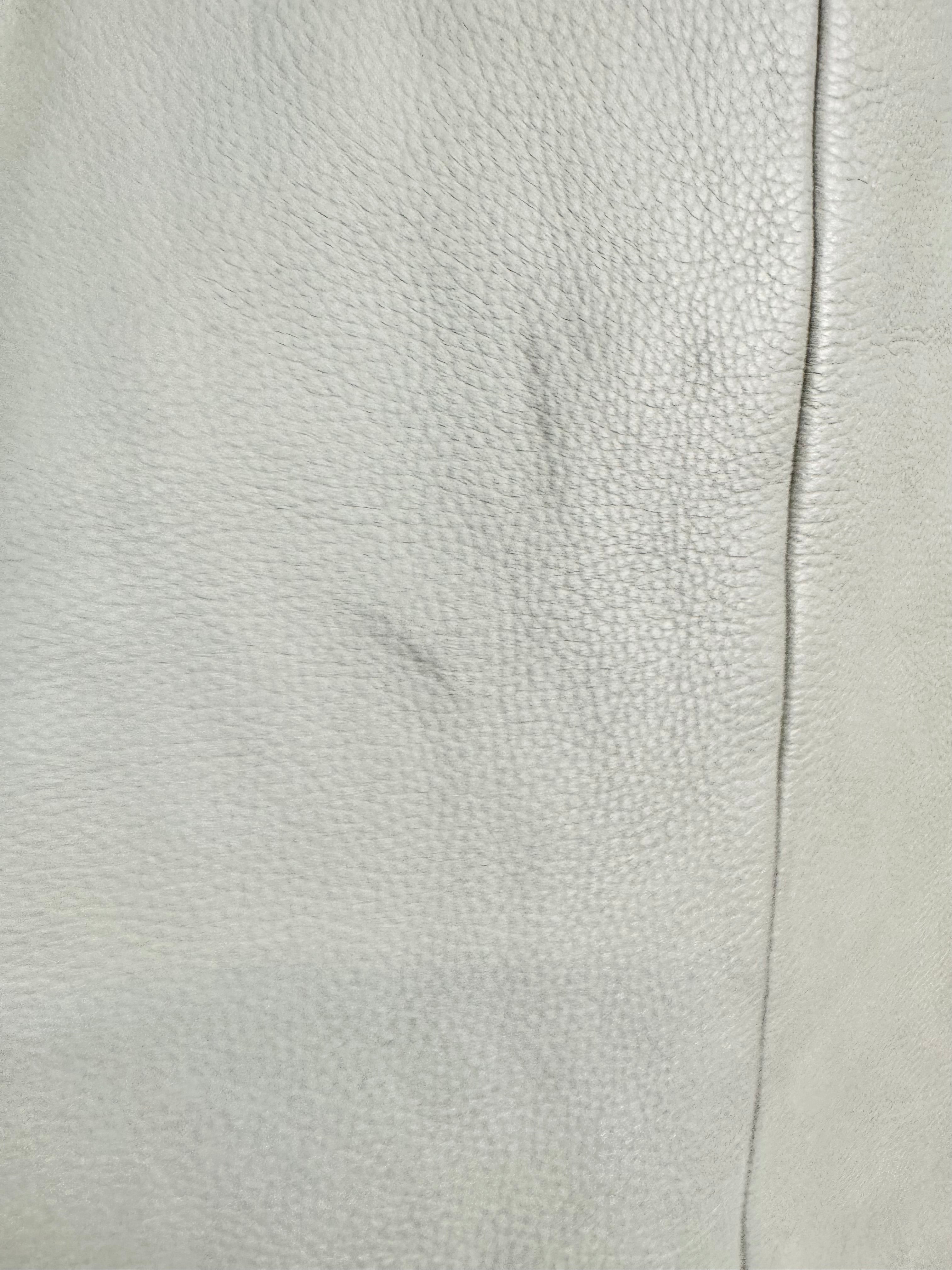 Close-up of light gray leather texture