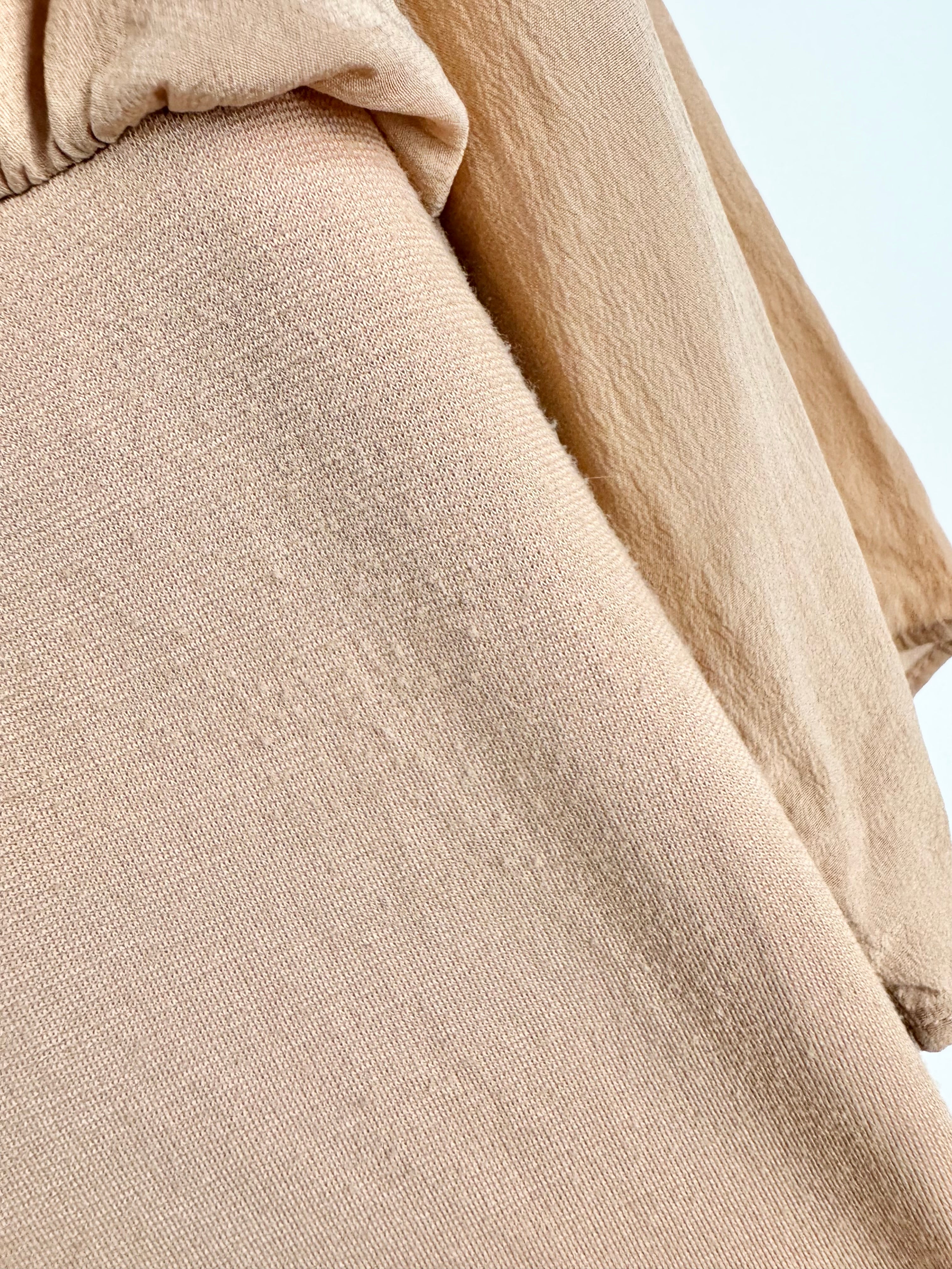 Close-up of beige fabric with a blurred background