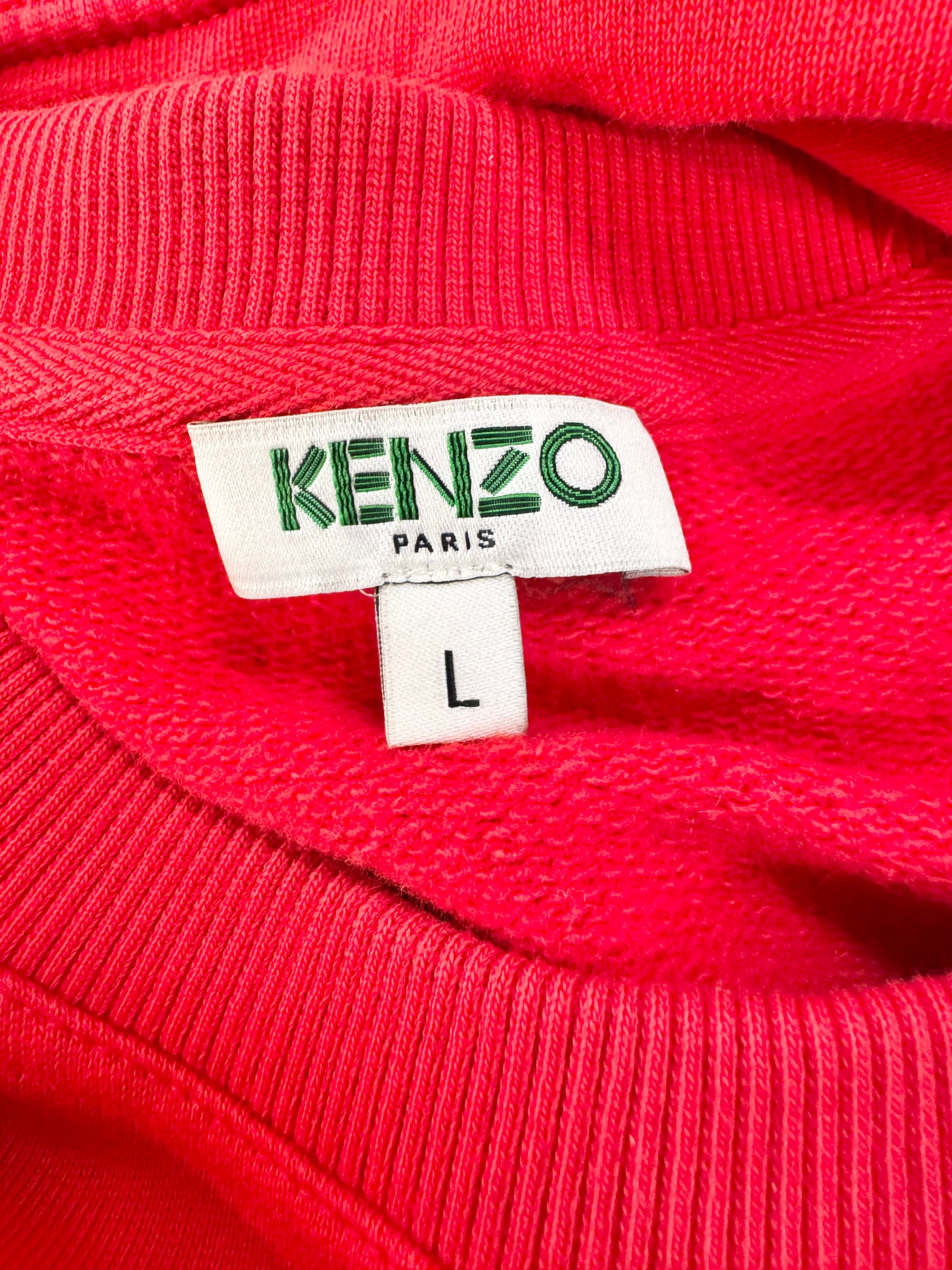 Close-up of a Kenzo Paris label on a red garment