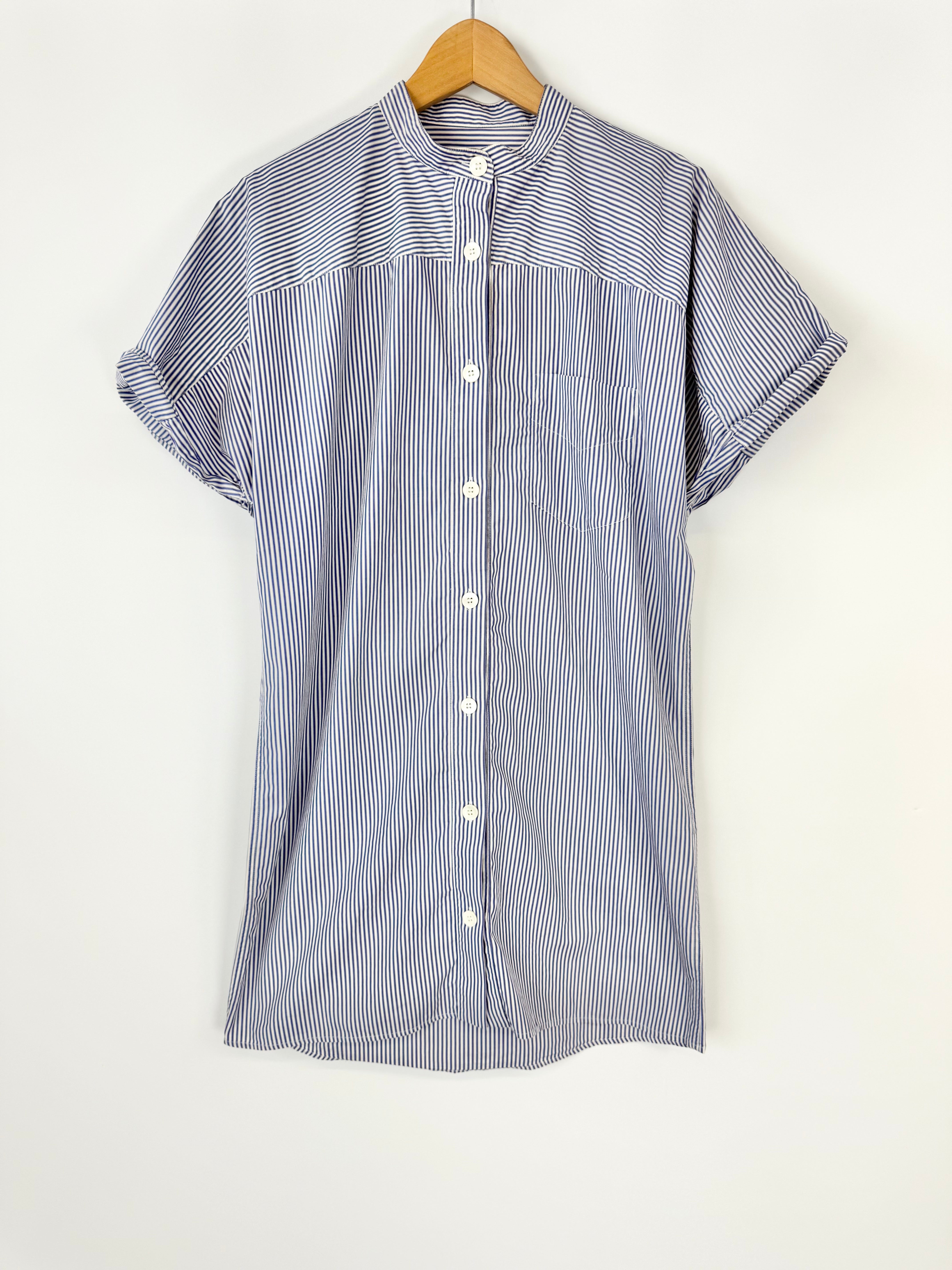 Striped shirt on a hanger against a white background