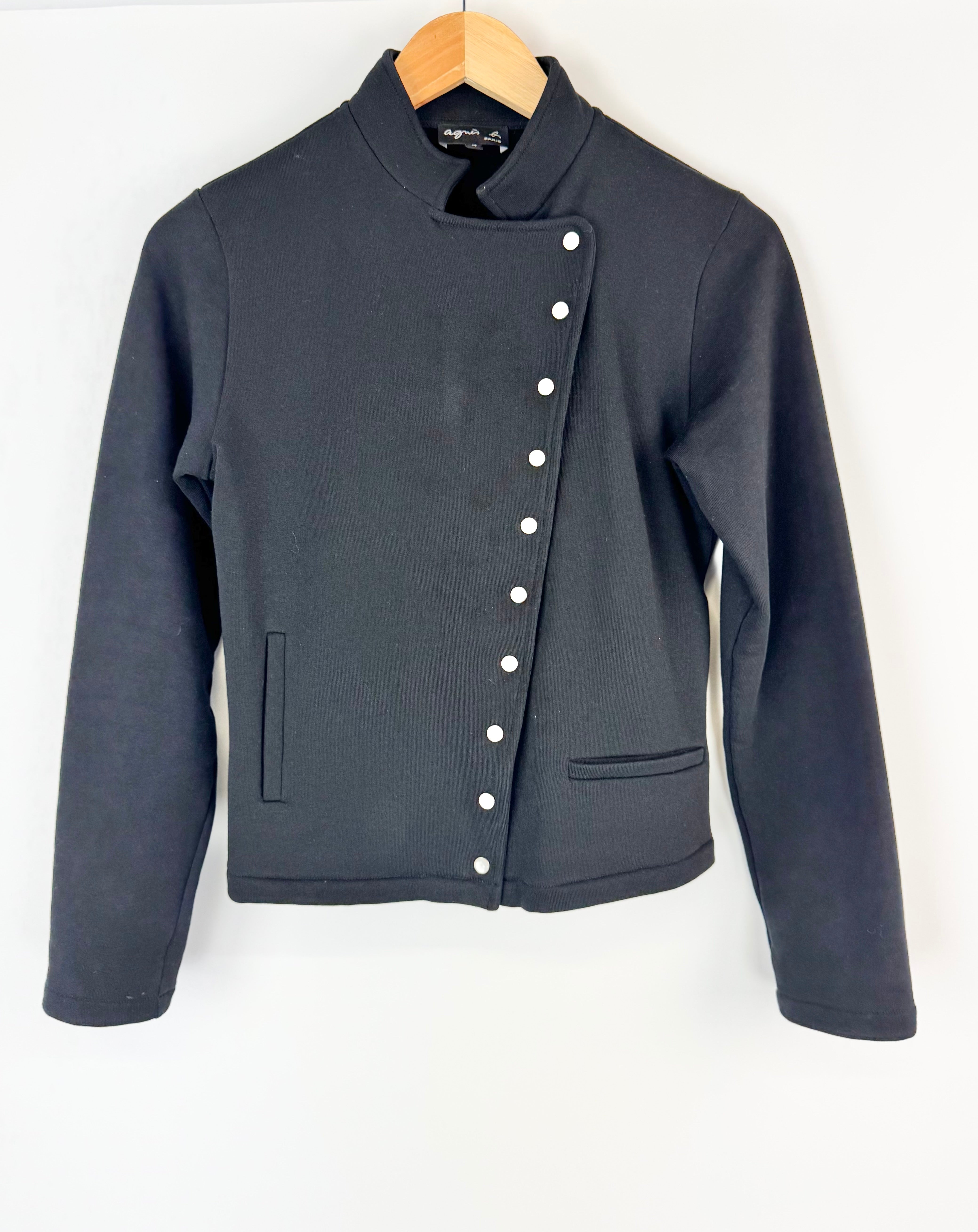 Black jacket with button details on a white background