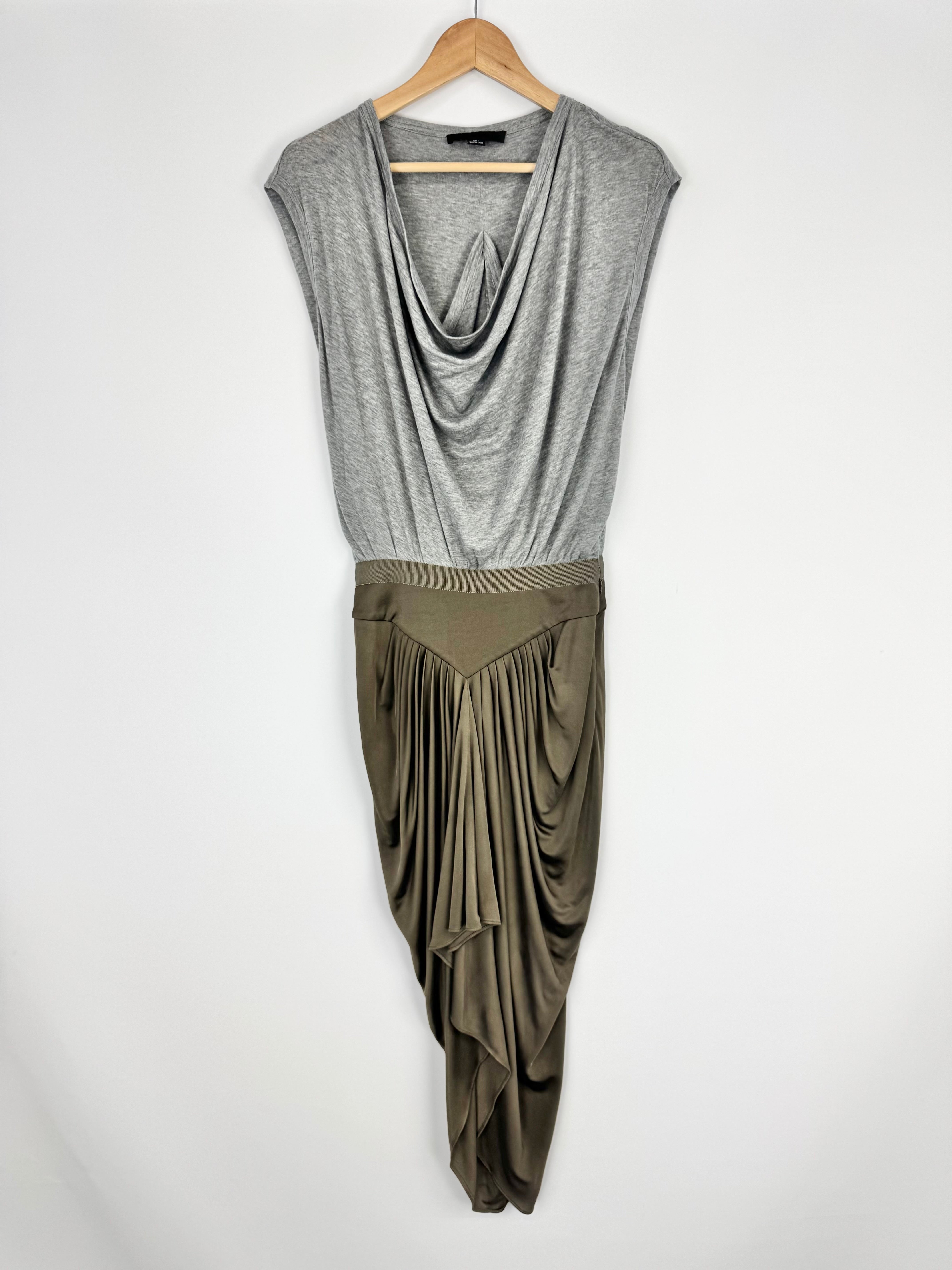 Gray and green dress on a hanger against a white background