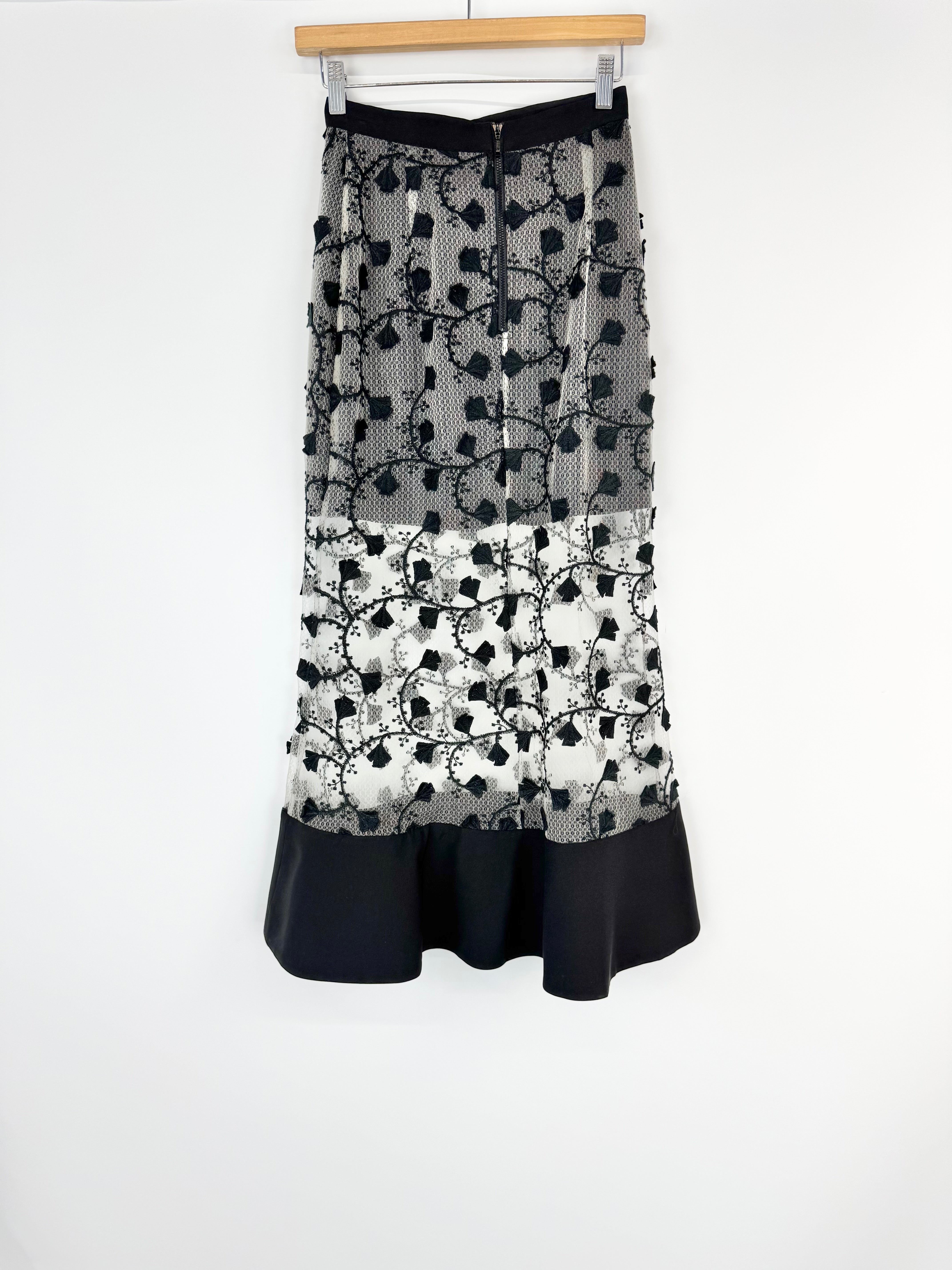Skirt with black and white floral pattern on a white background