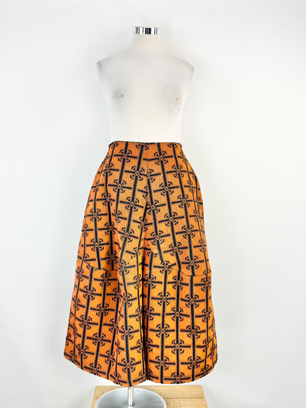 Slacks with black geometric pattern on a mannequin against a white background