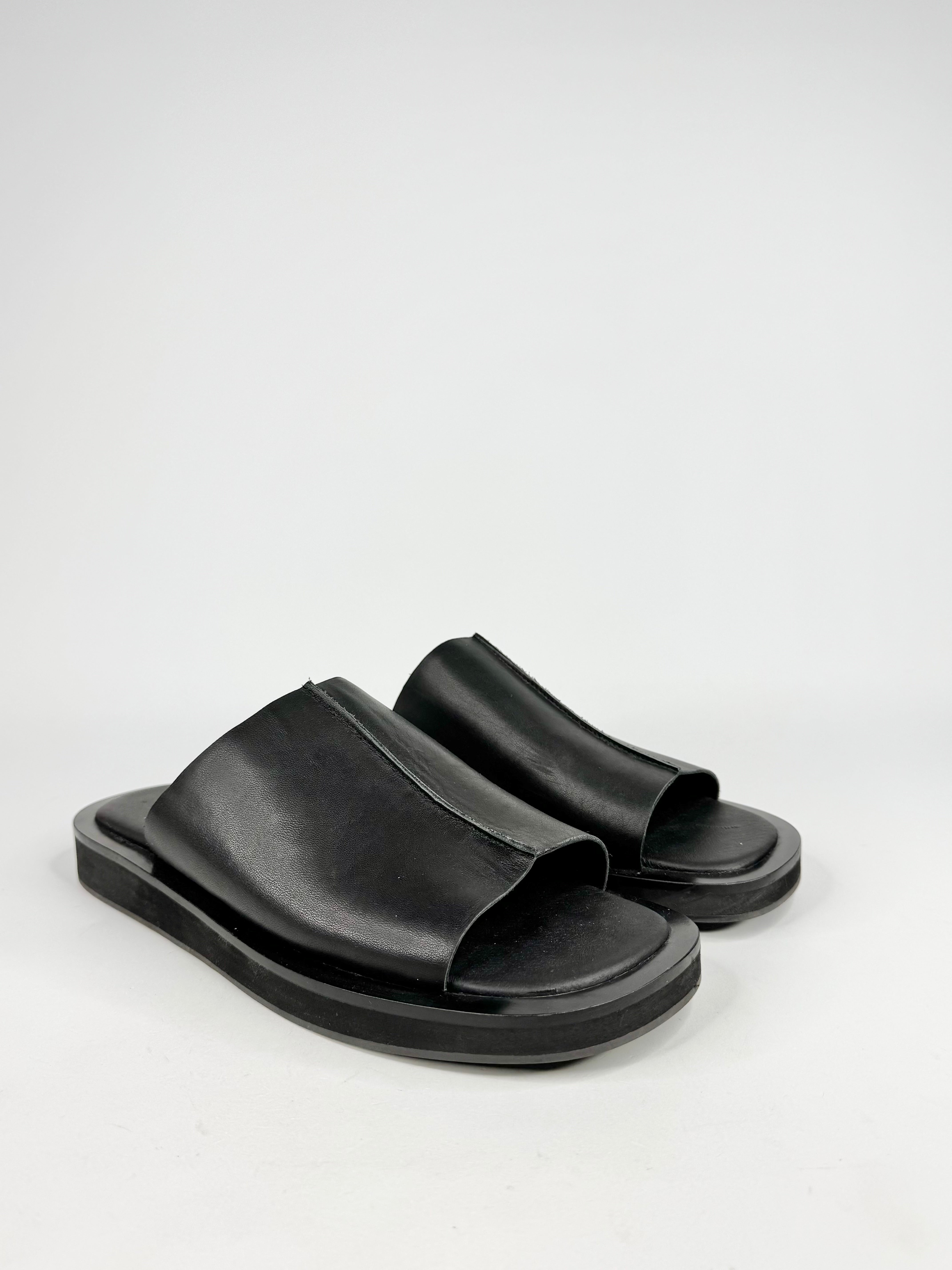 Black sandals on a white background