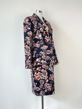 Ann Taylor navy blue floral two-piece blazer and skirt set, with the skirt displaying a floral pattern and the blazer having a solid navy color.