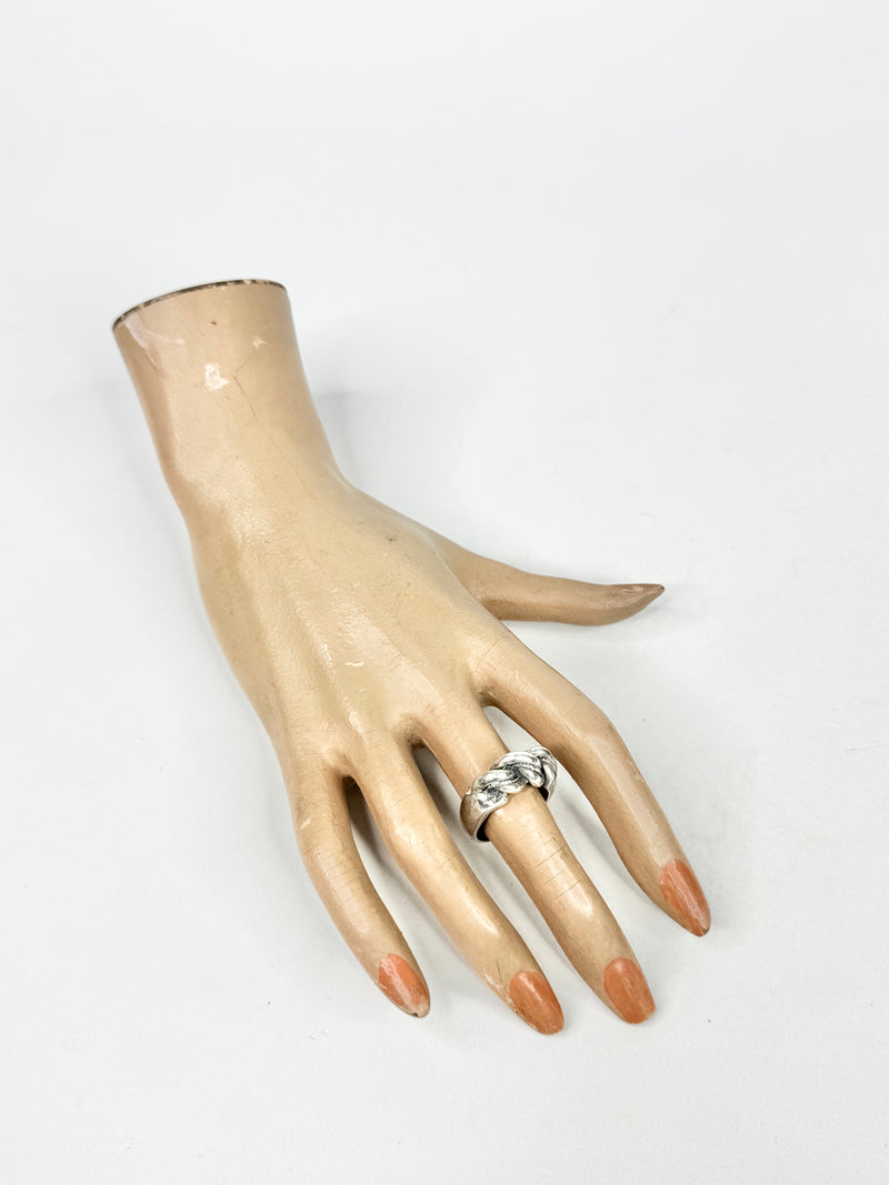 Mannequin hand with a ring on a white background