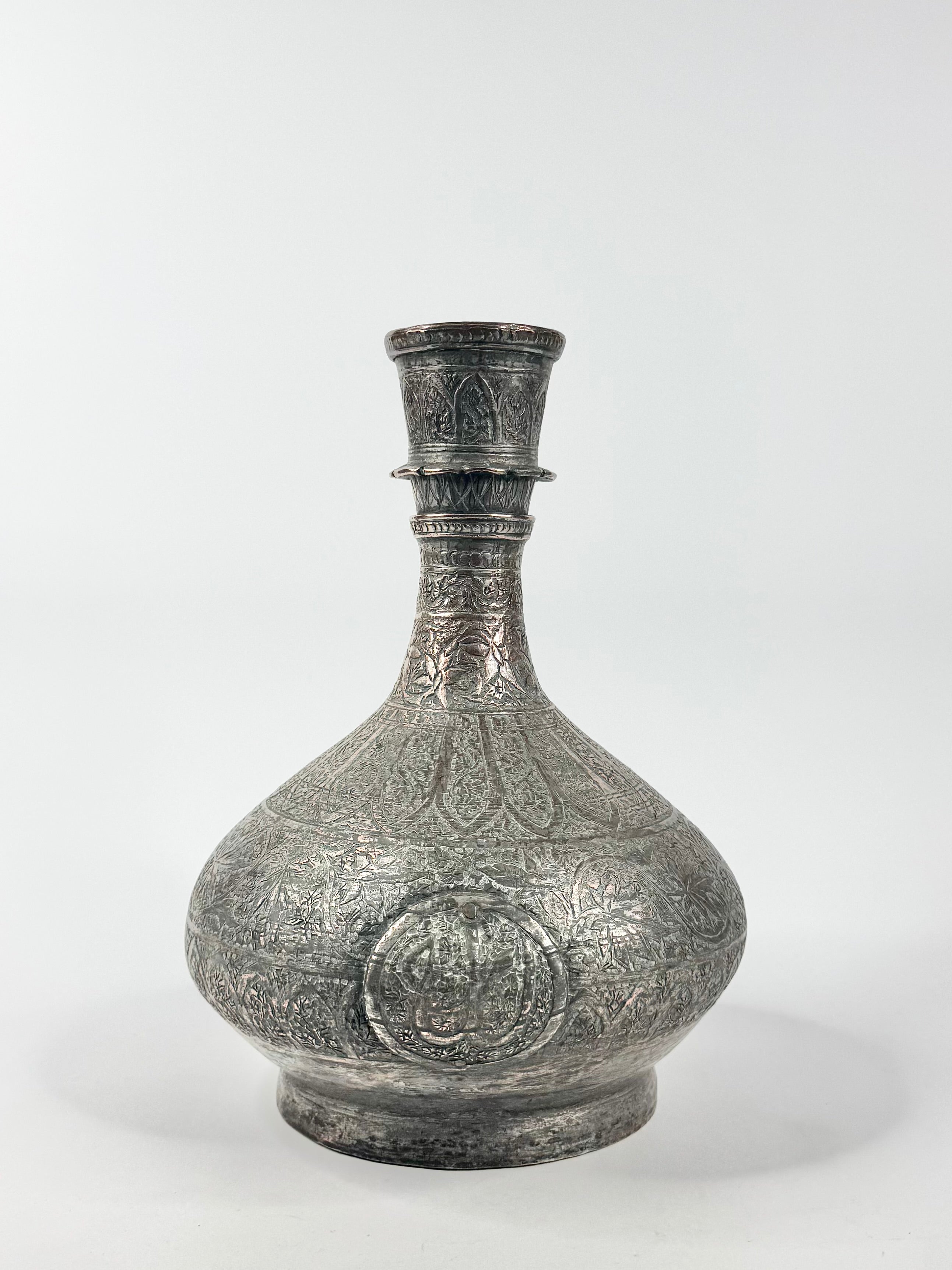 Decorative silver vase on a white background