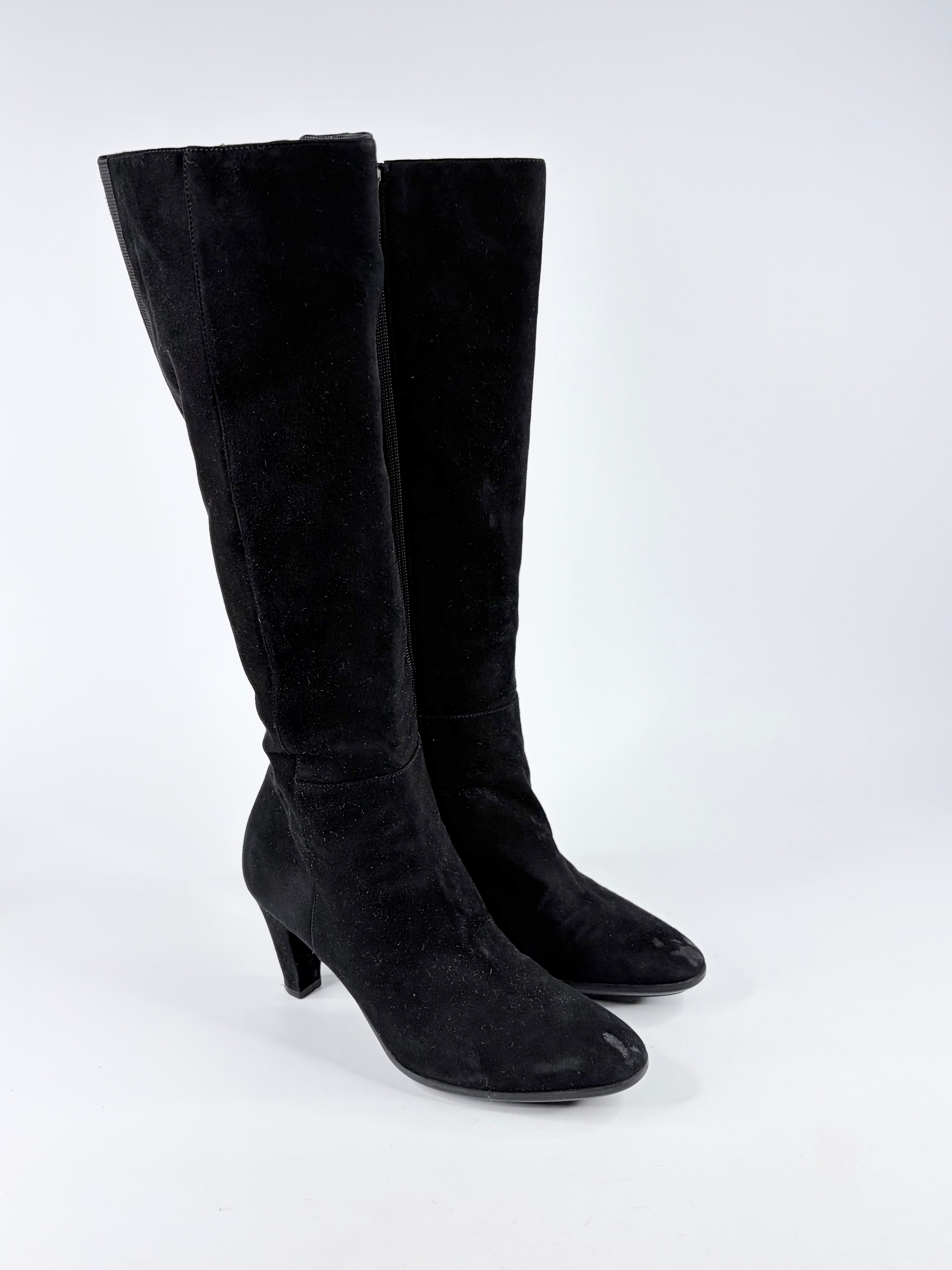 Black knee-high boots on a white background