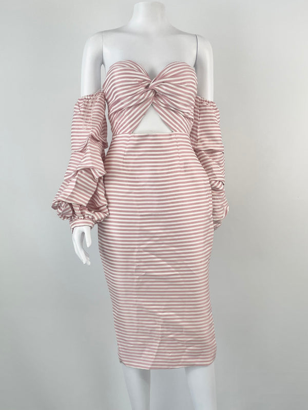 An off-shoulder, form-fitting pink striped dress with a candy-eyed detail on the shoulder, displayed on a mannequin.