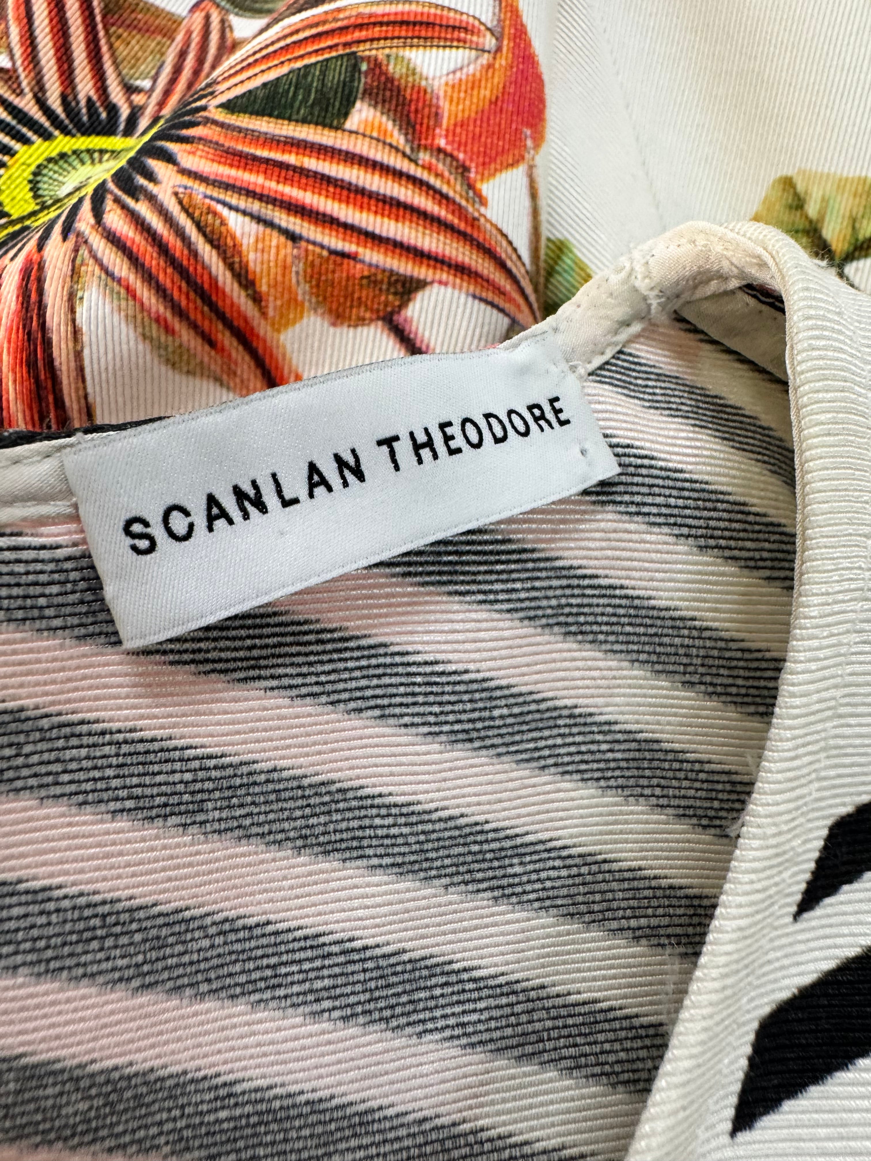 Close-up of a garment with a 'Scanlan Theodore' label and floral pattern.