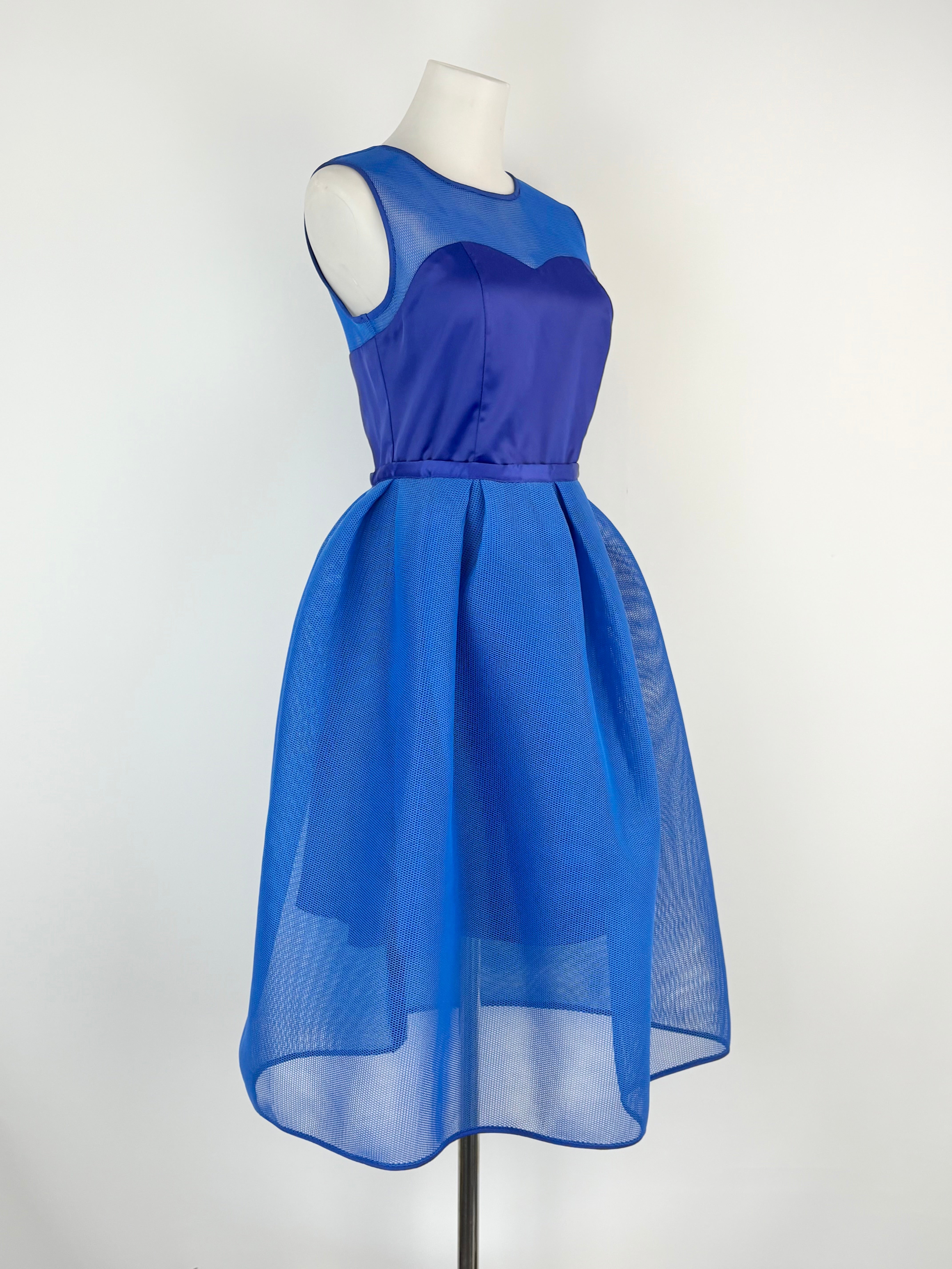 Blue dress on a mannequin against a white background