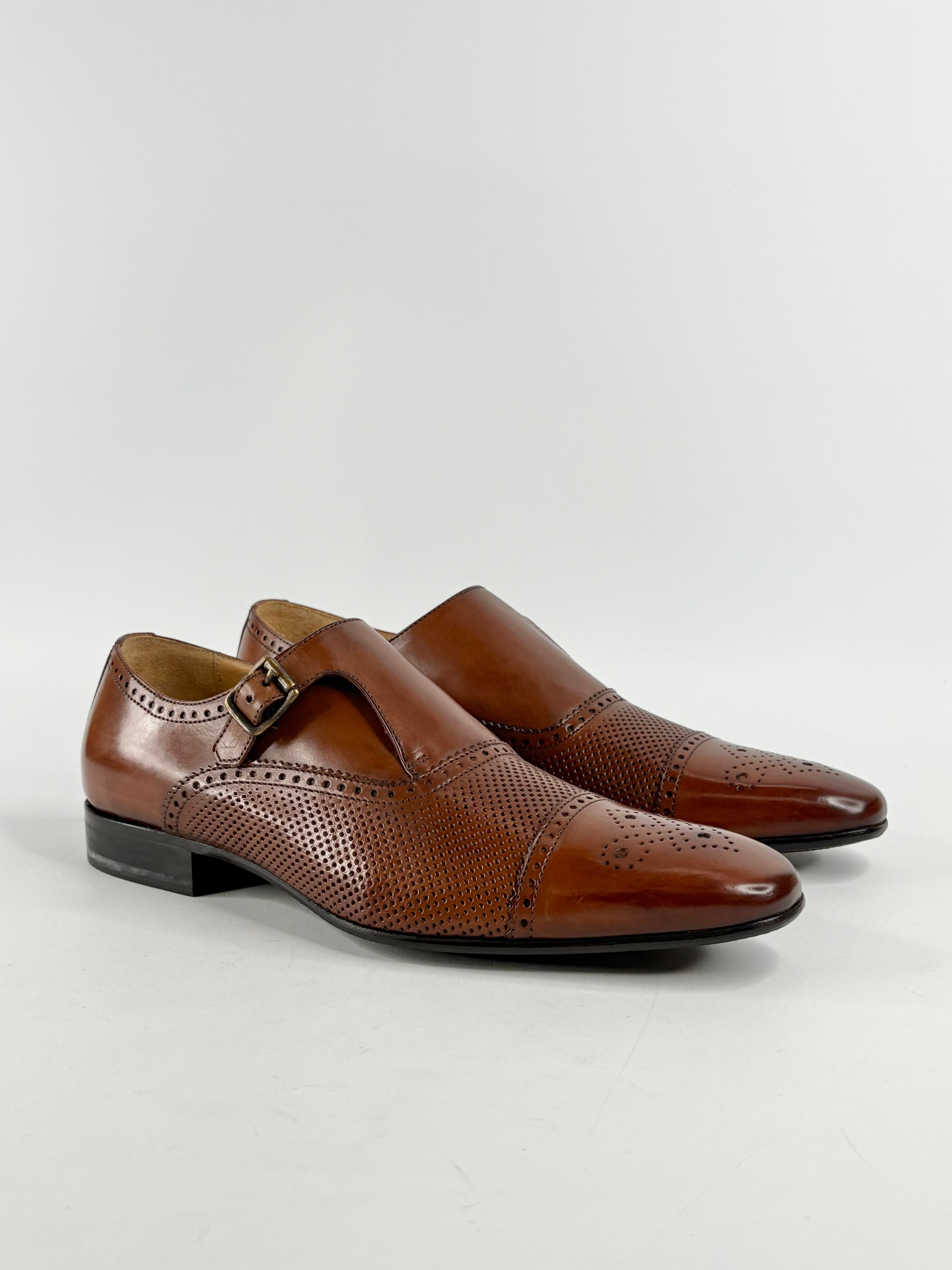 A pair of brown mahogany leather monk strap loafers with buckle closure, displayed against a white background.