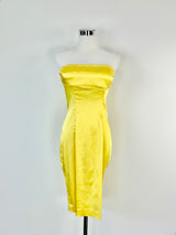 A yellow strapless midi dress displayed on a mannequin against a white background.