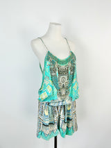 Patterned dress on a mannequin against a white background