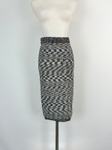 A black and white geometric patterned skirt displayed on a mannequin.