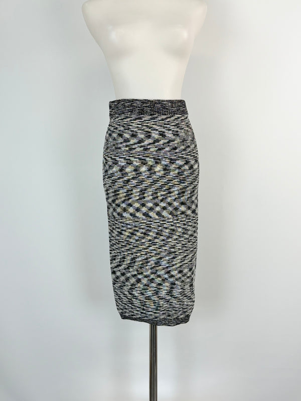 A black and white geometric patterned skirt displayed on a mannequin.