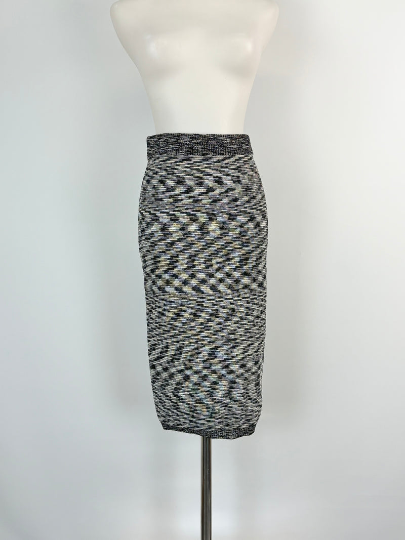 A black and white geometric patterned skirt displayed on a mannequin.