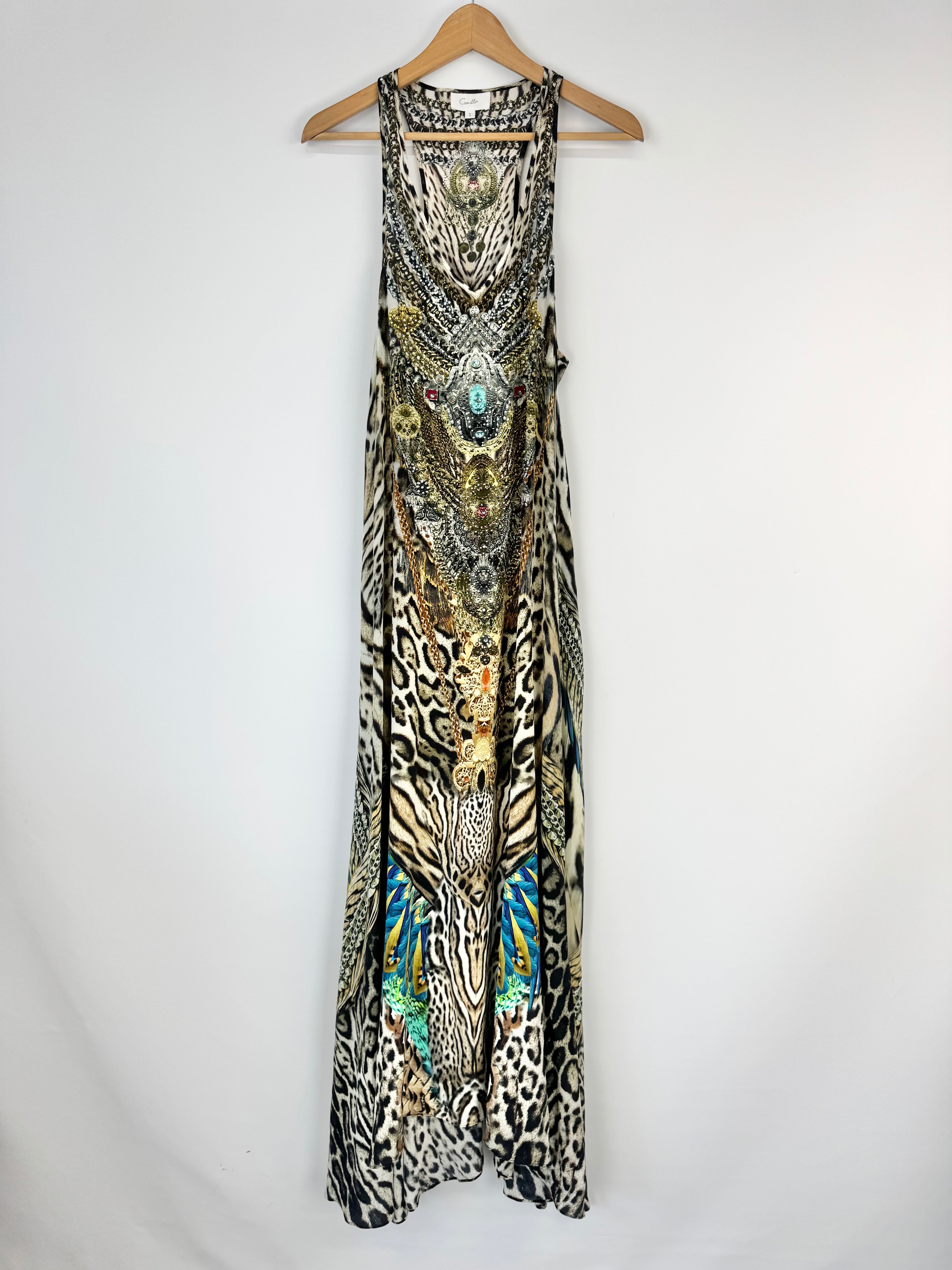 Animal print dress on a hanger against a white background