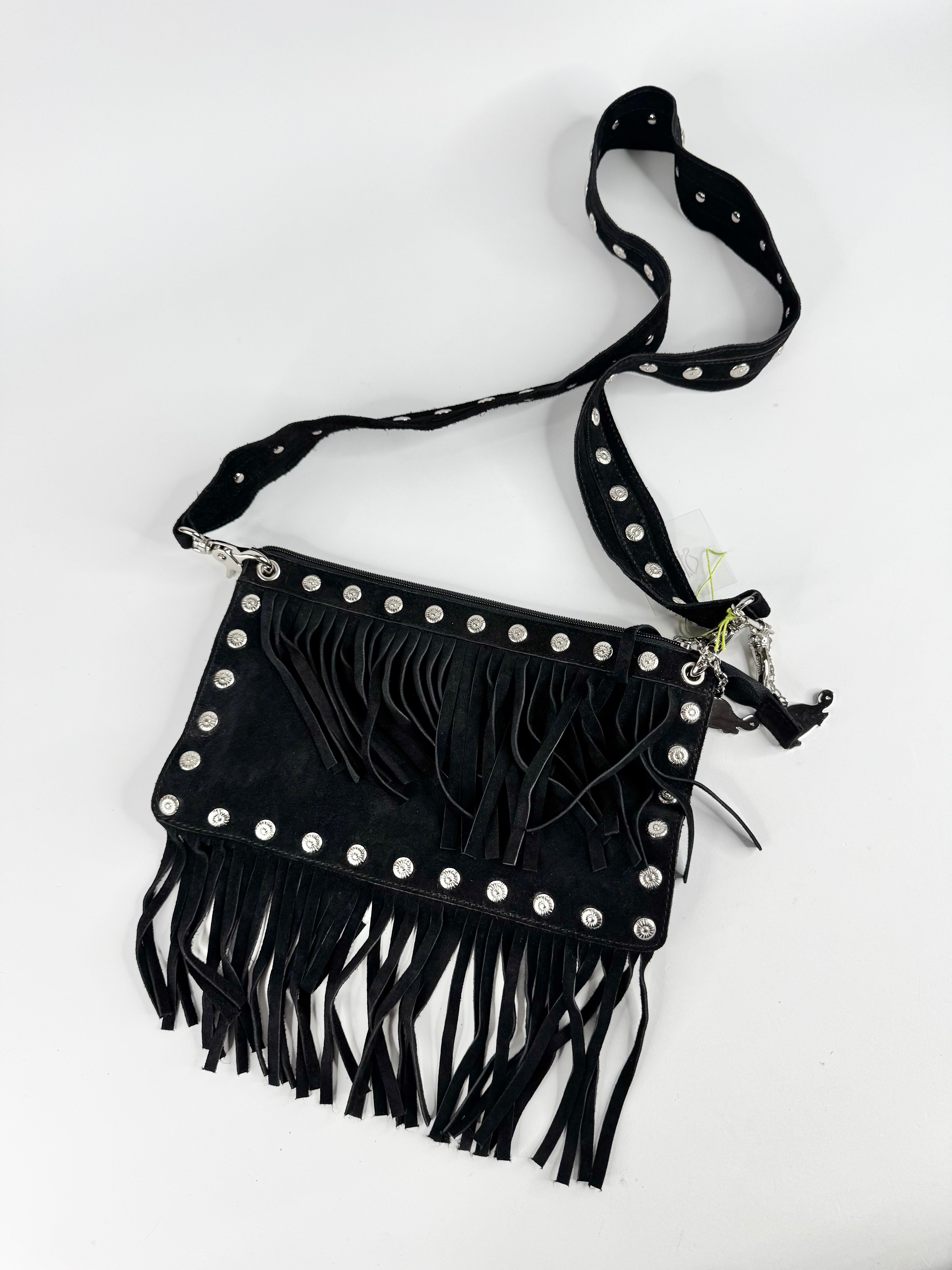 Black fringe bag with studs on a white background