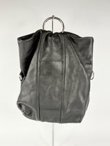 Black leather handbag on a white background