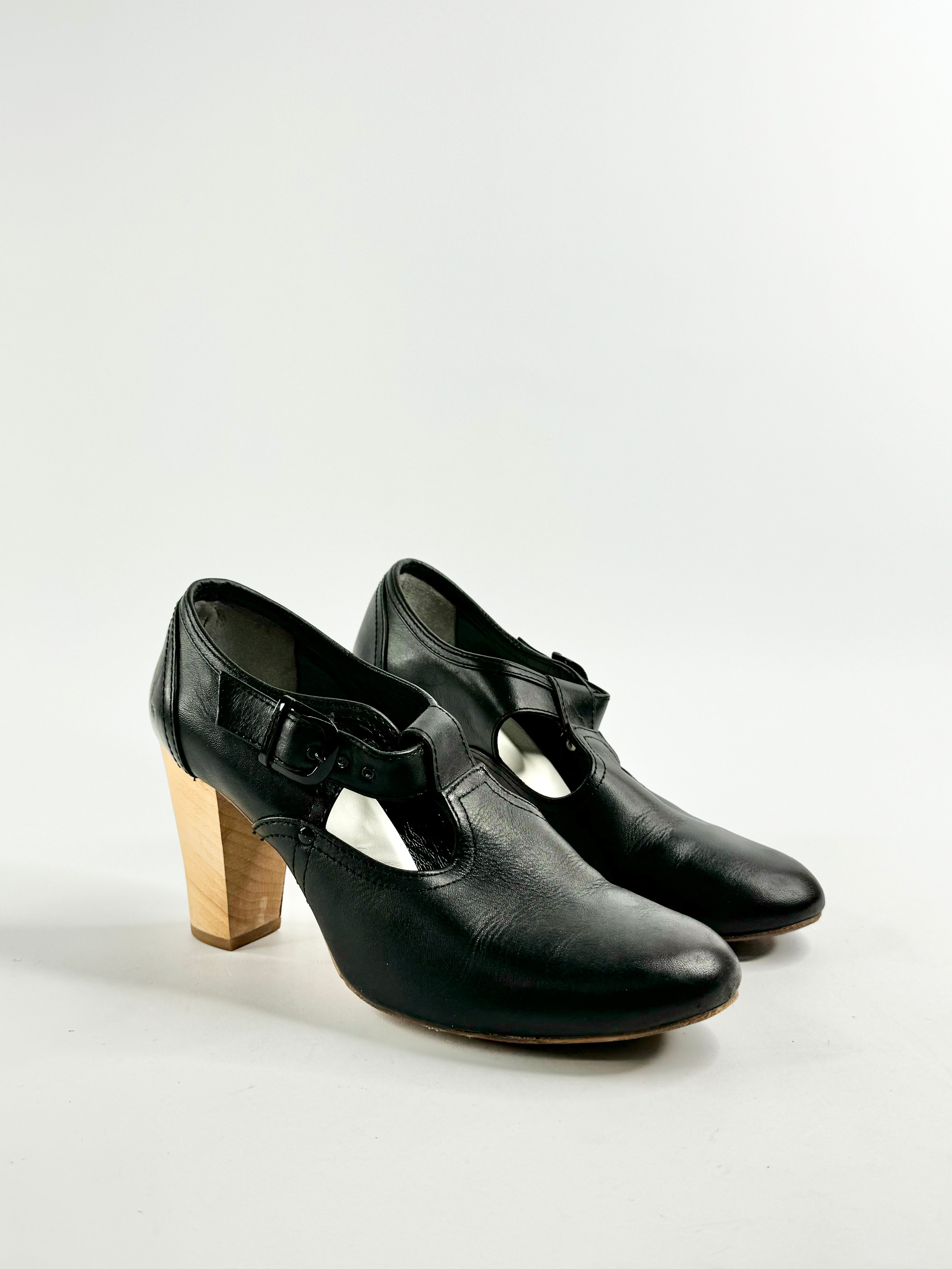 A pair of black leather Mary Jane shoes with wooden heel, made in Japan.