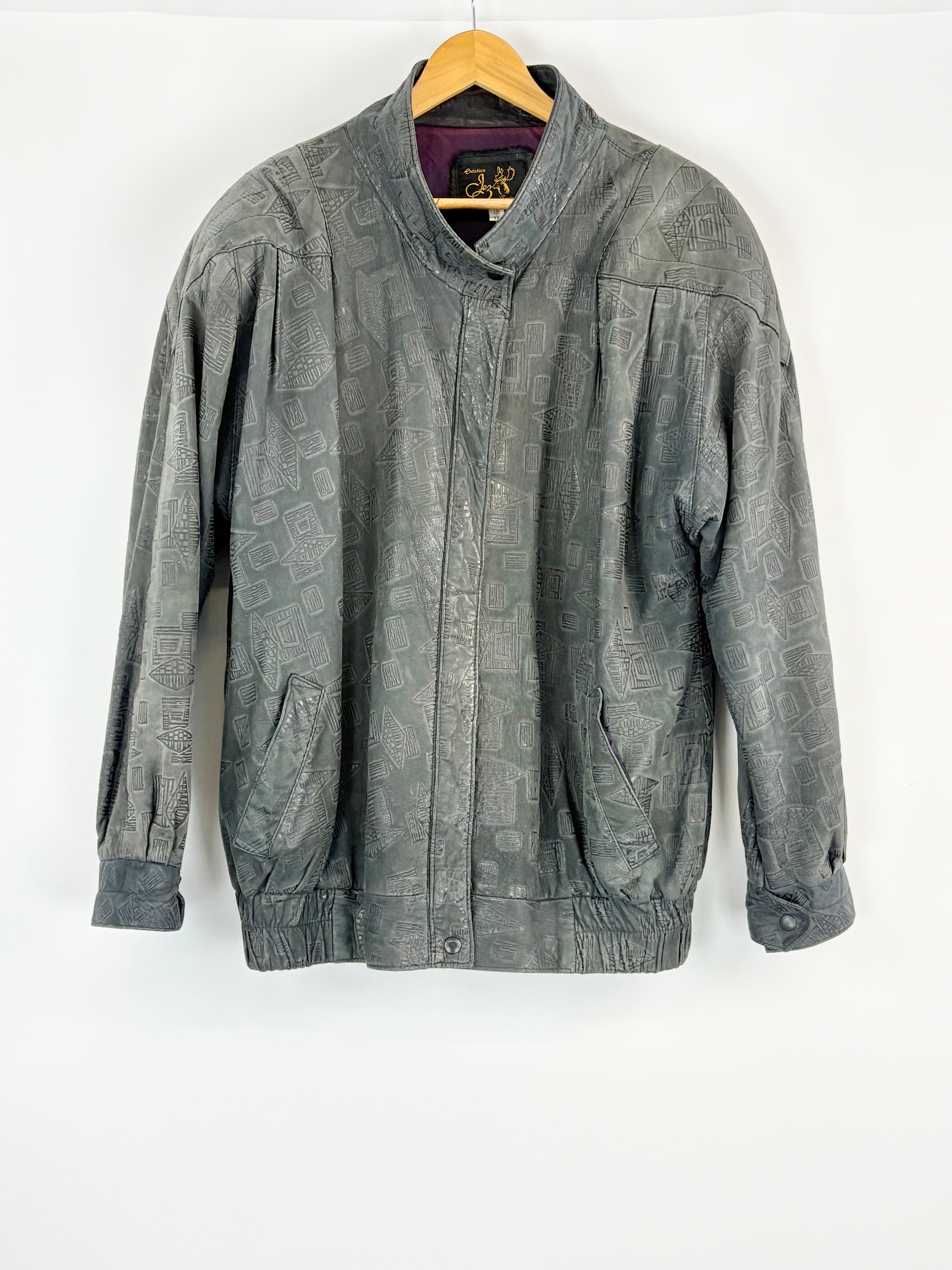 Black jacket on a hanger against a white background