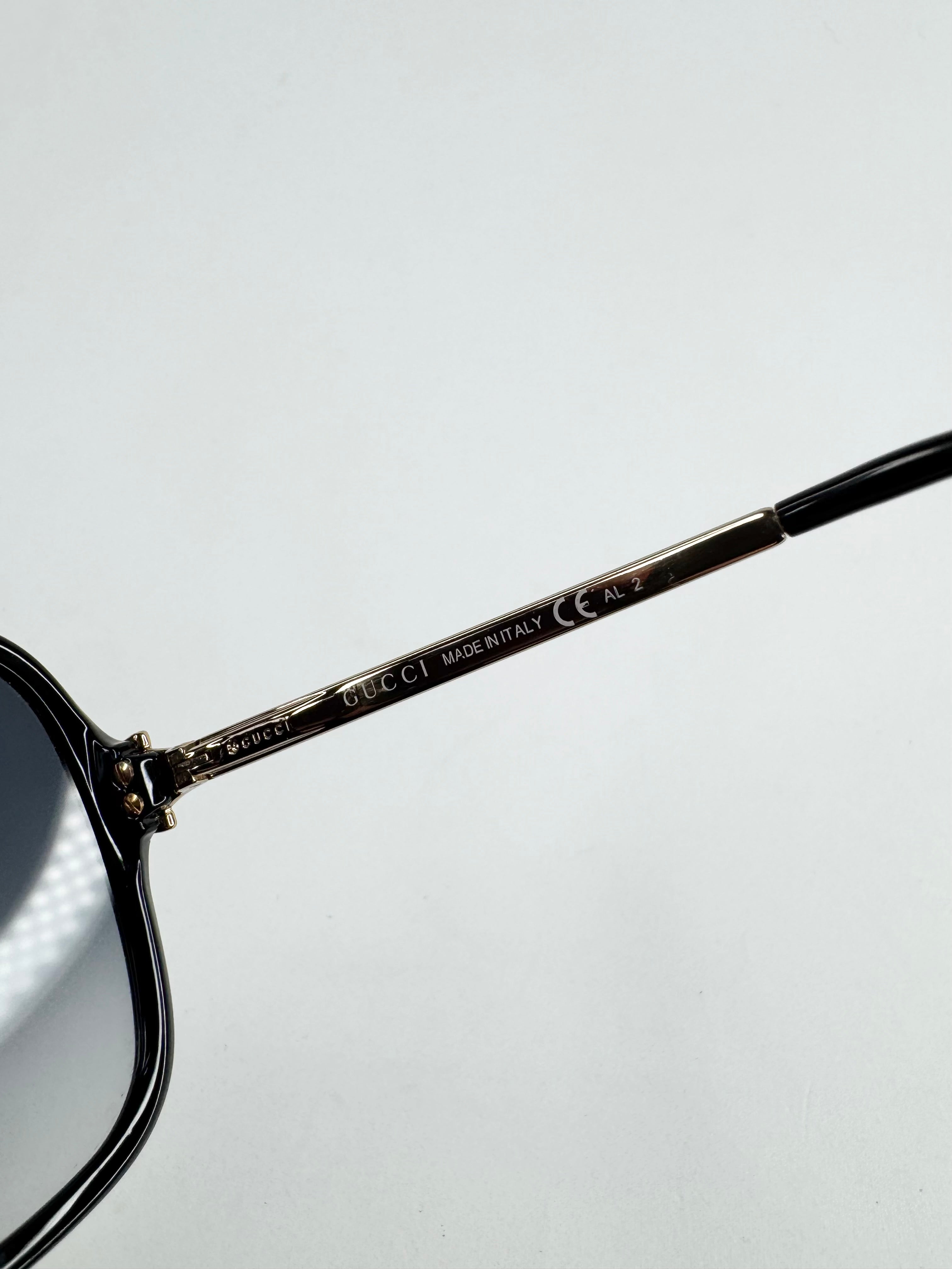 Gucci Black and Gold Round Sunglasses