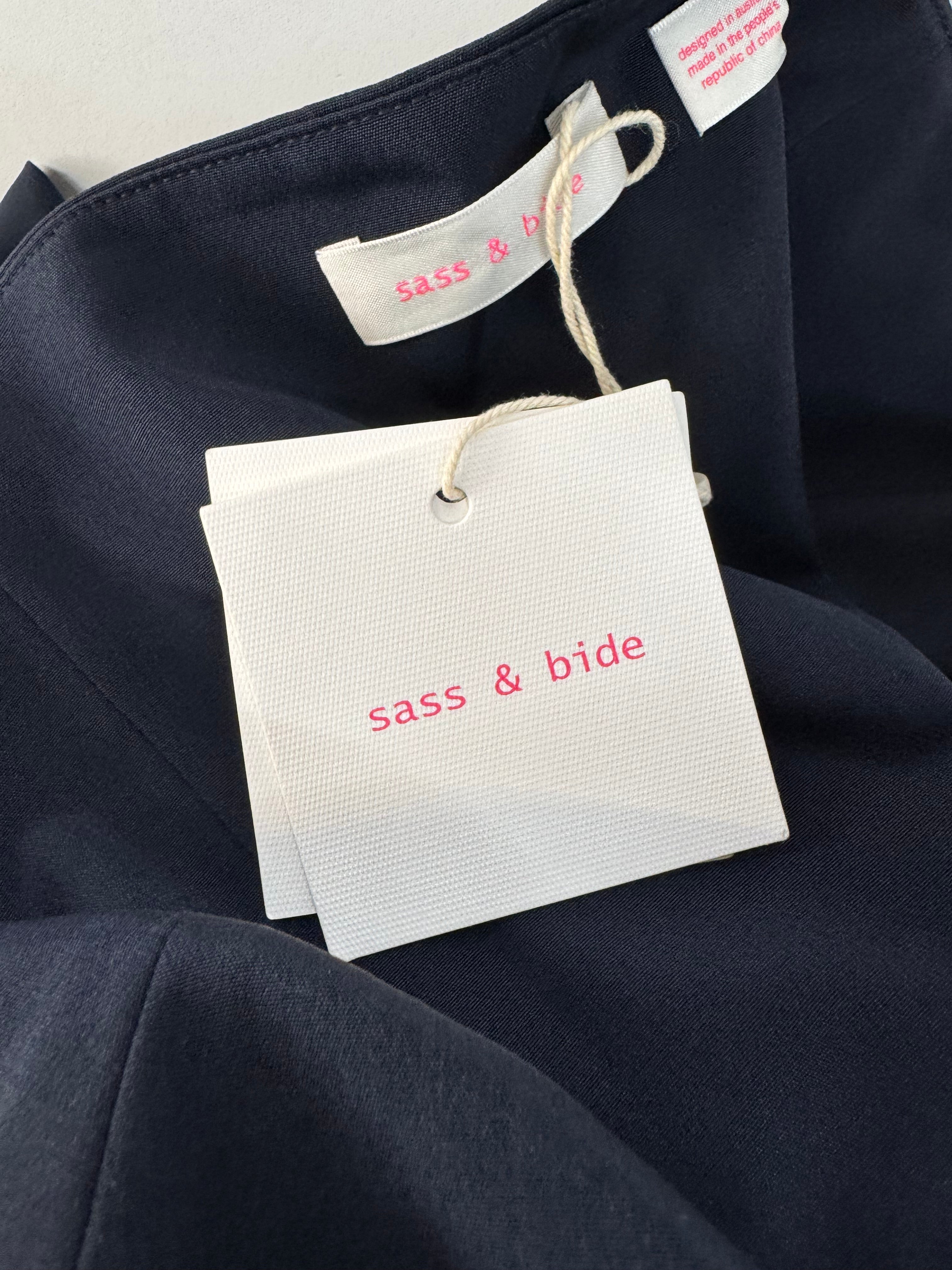 Navy fabric with 'sass & bride' tags on a dark background