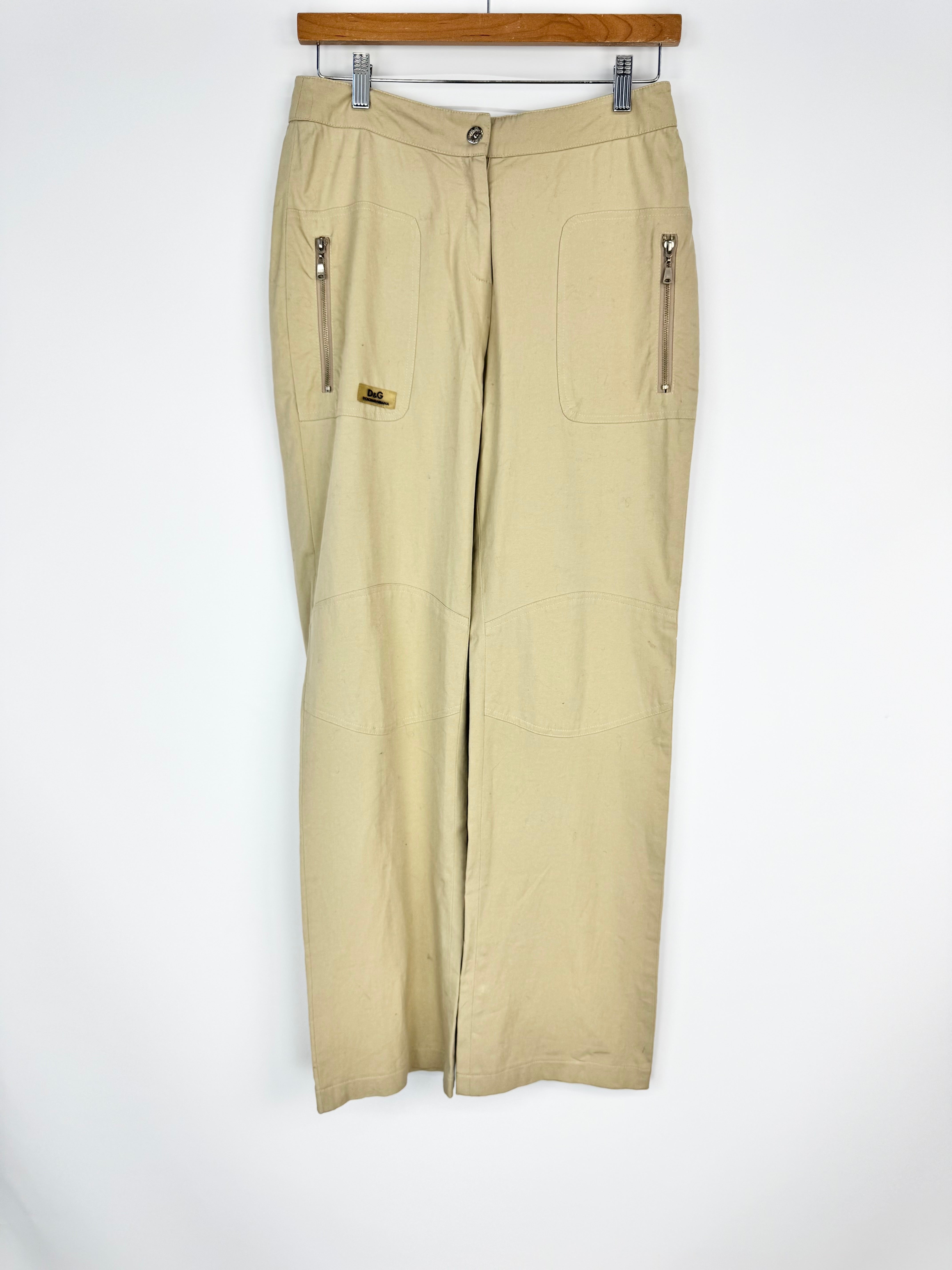 Beige pants on a hanger against a white background