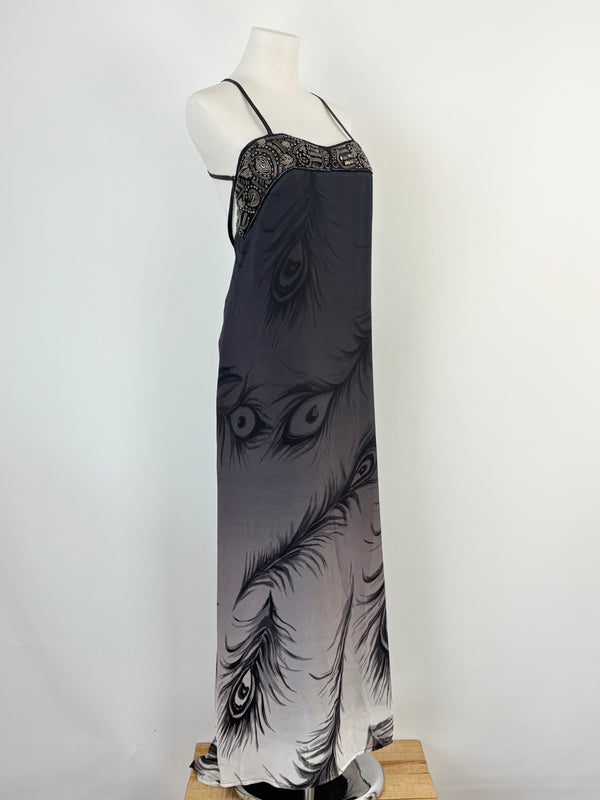 A long black embellished strapless slip dress with a feather pattern, displayed on a mannequin.