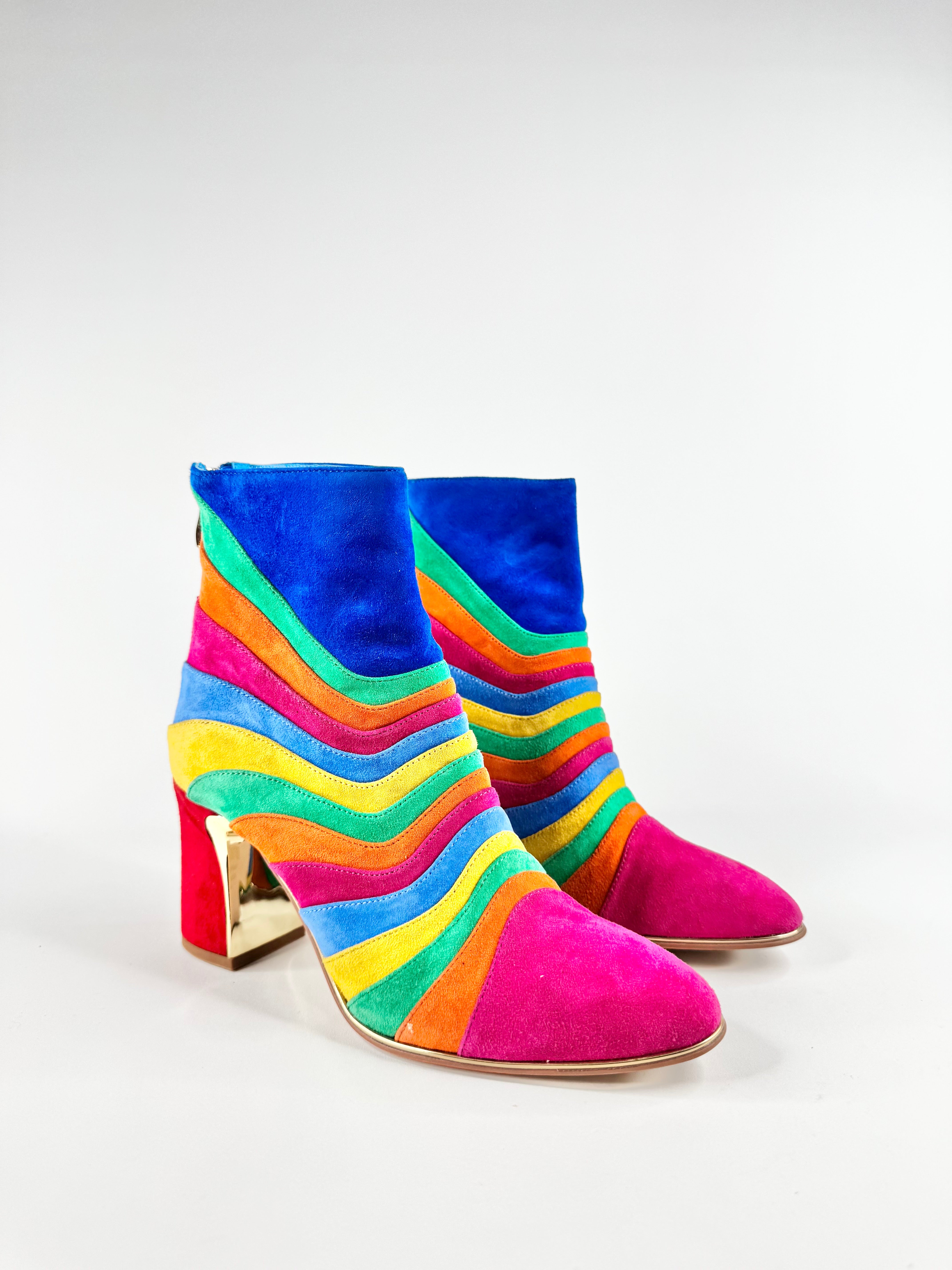 Colorful striped ankle boots on a white background