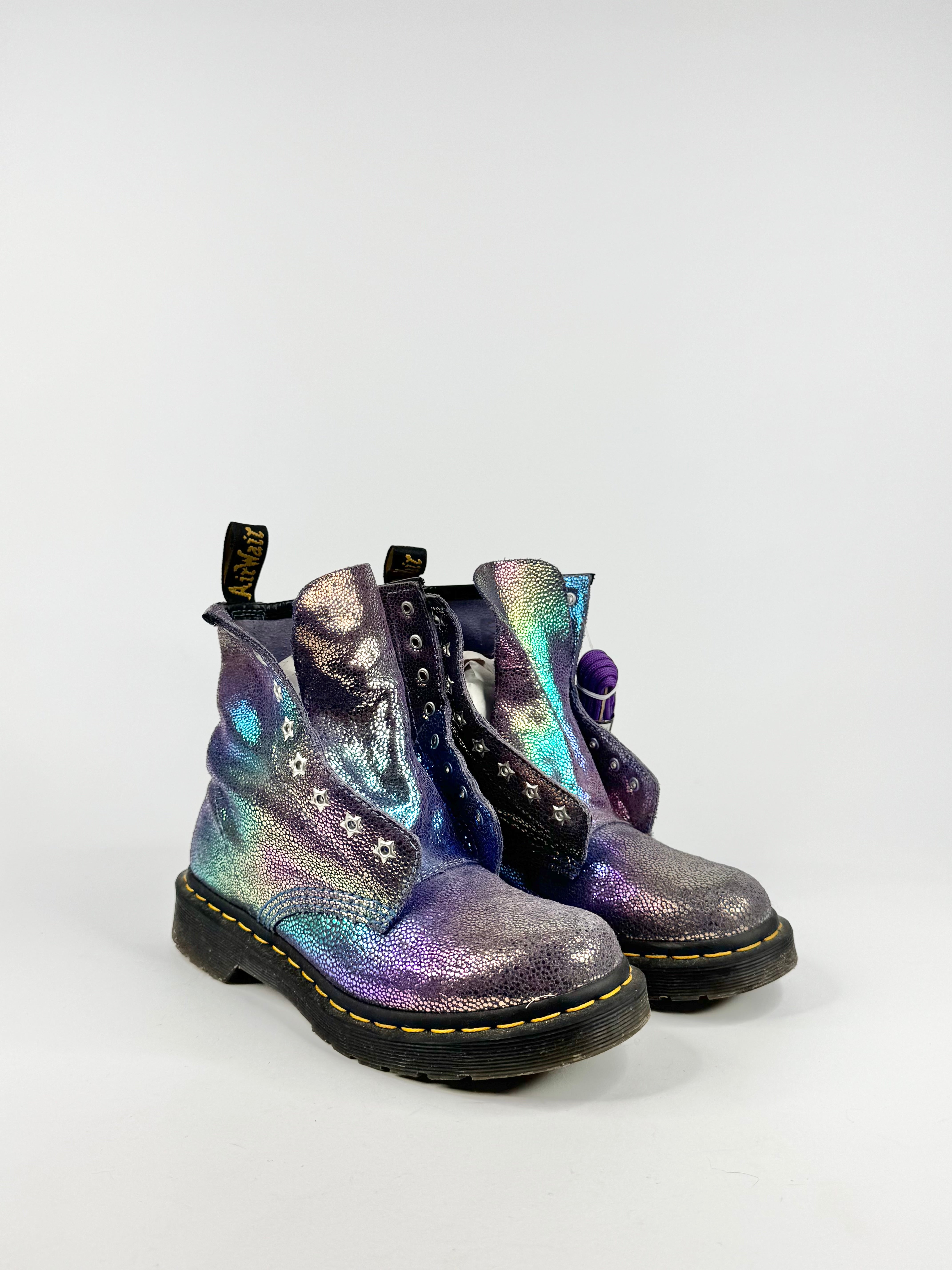 Pair of iridescent boots on a white background