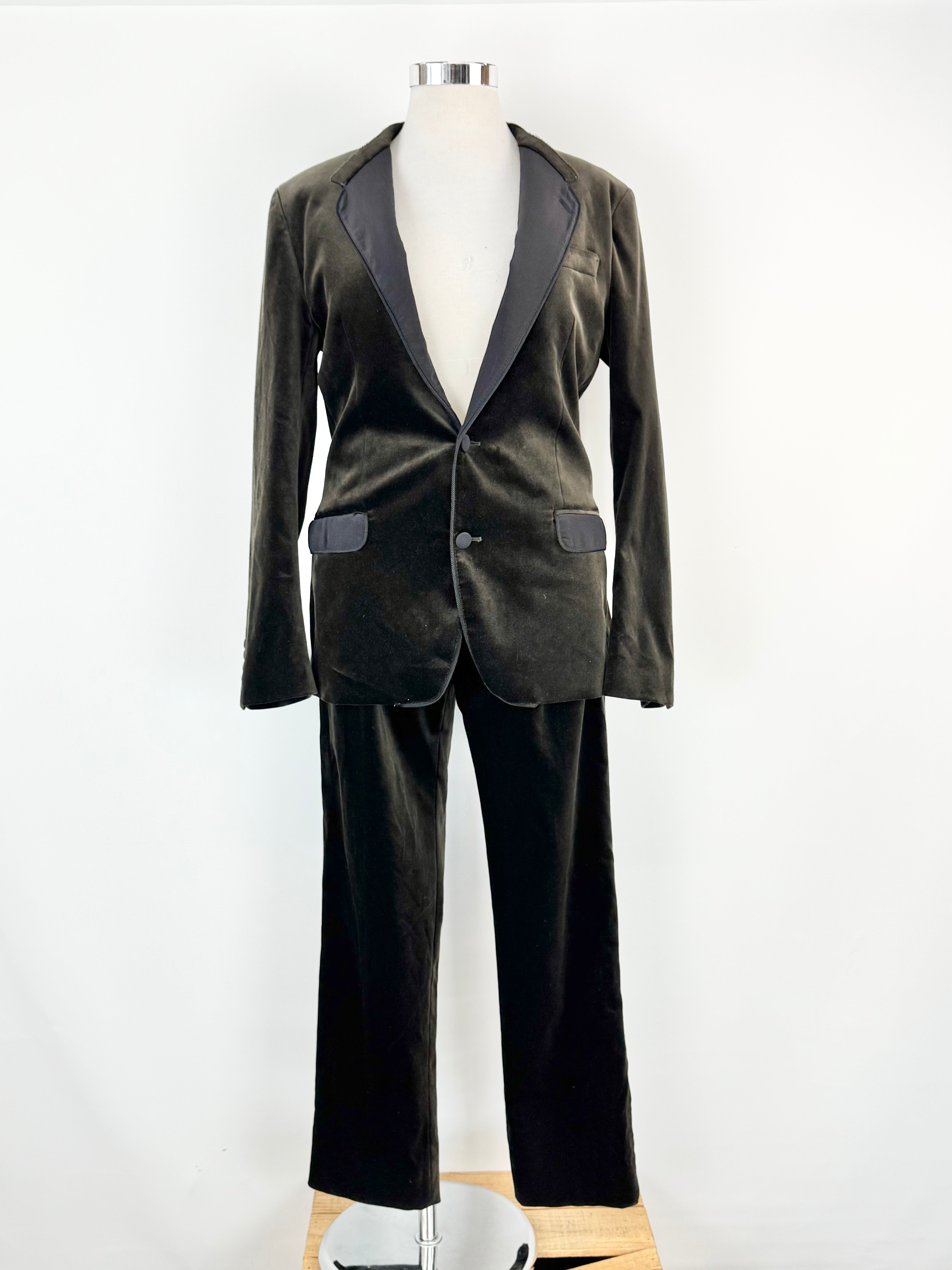 Brown velvet suit on a mannequin against a white background