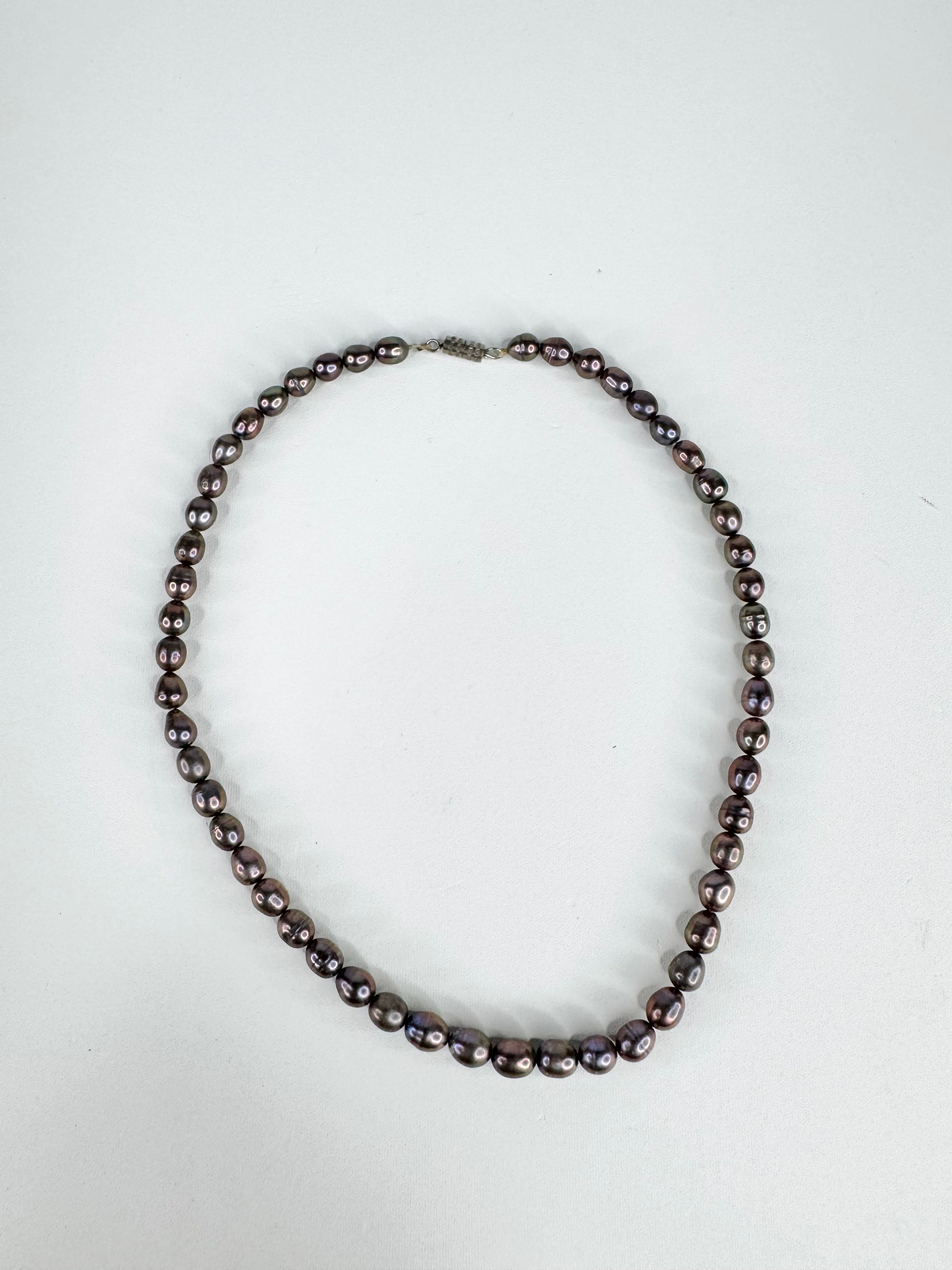 Pearl necklace on a white background