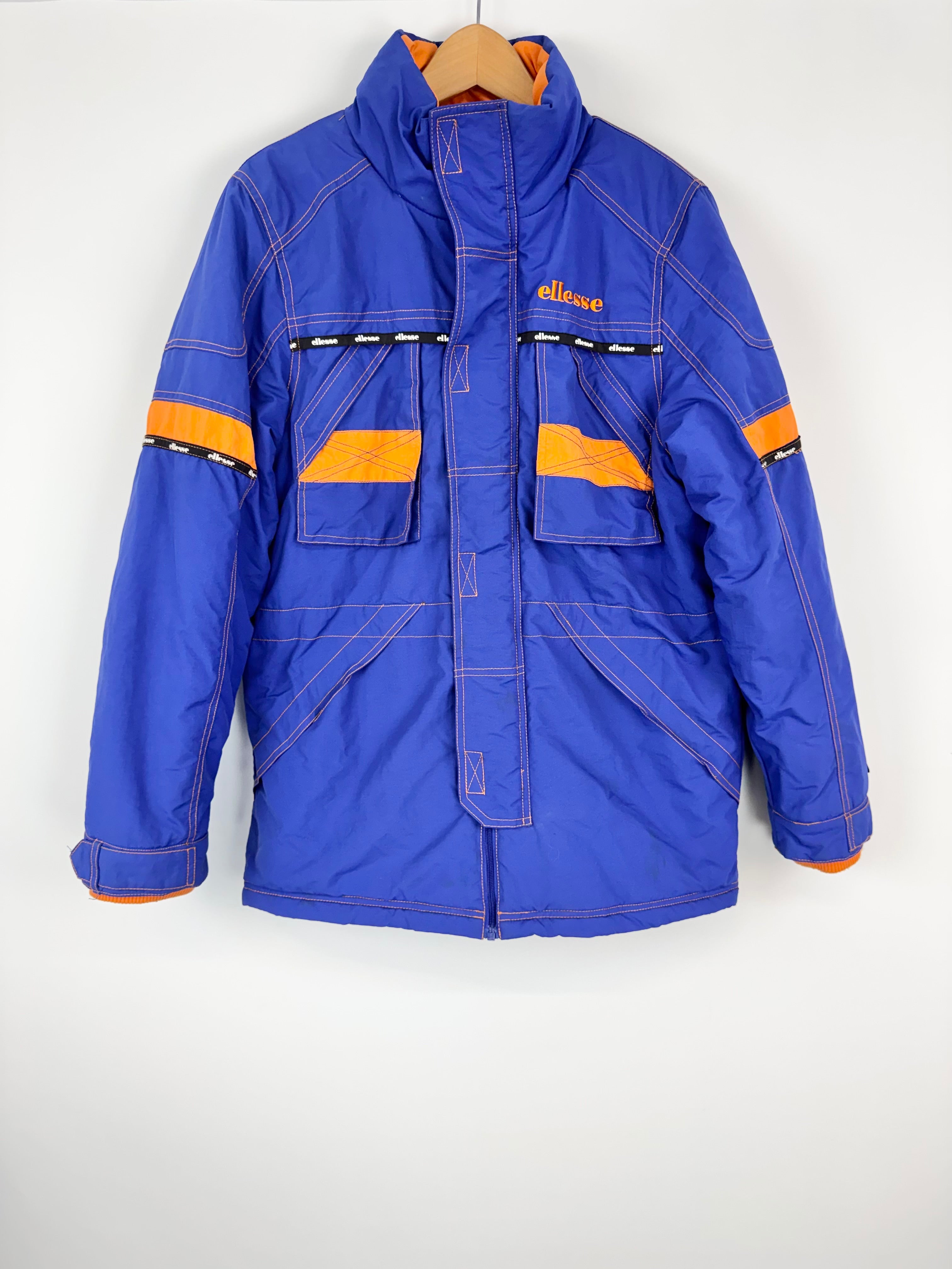 Blue jacket with orange accents on a white background