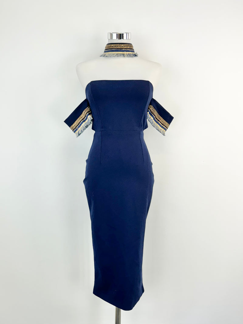 A navy blue midi dress with gold embellishments on the sleeves, displayed on a mannequin.