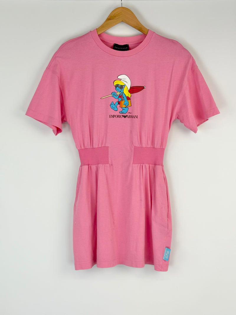 Pink dress with a cartoon character on a hanger against a white background