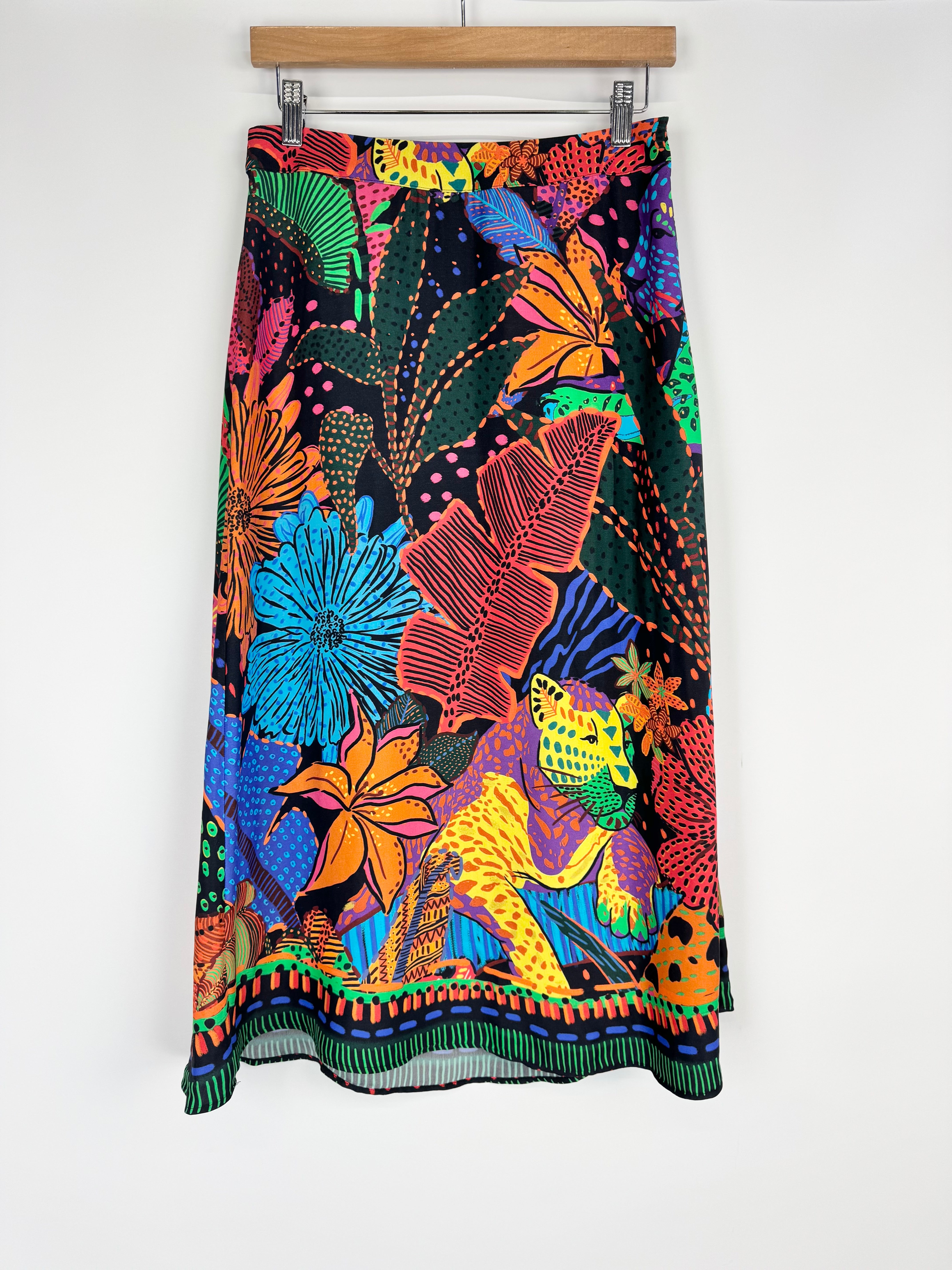 Colorful floral skirt with a vibrant pattern on a white background