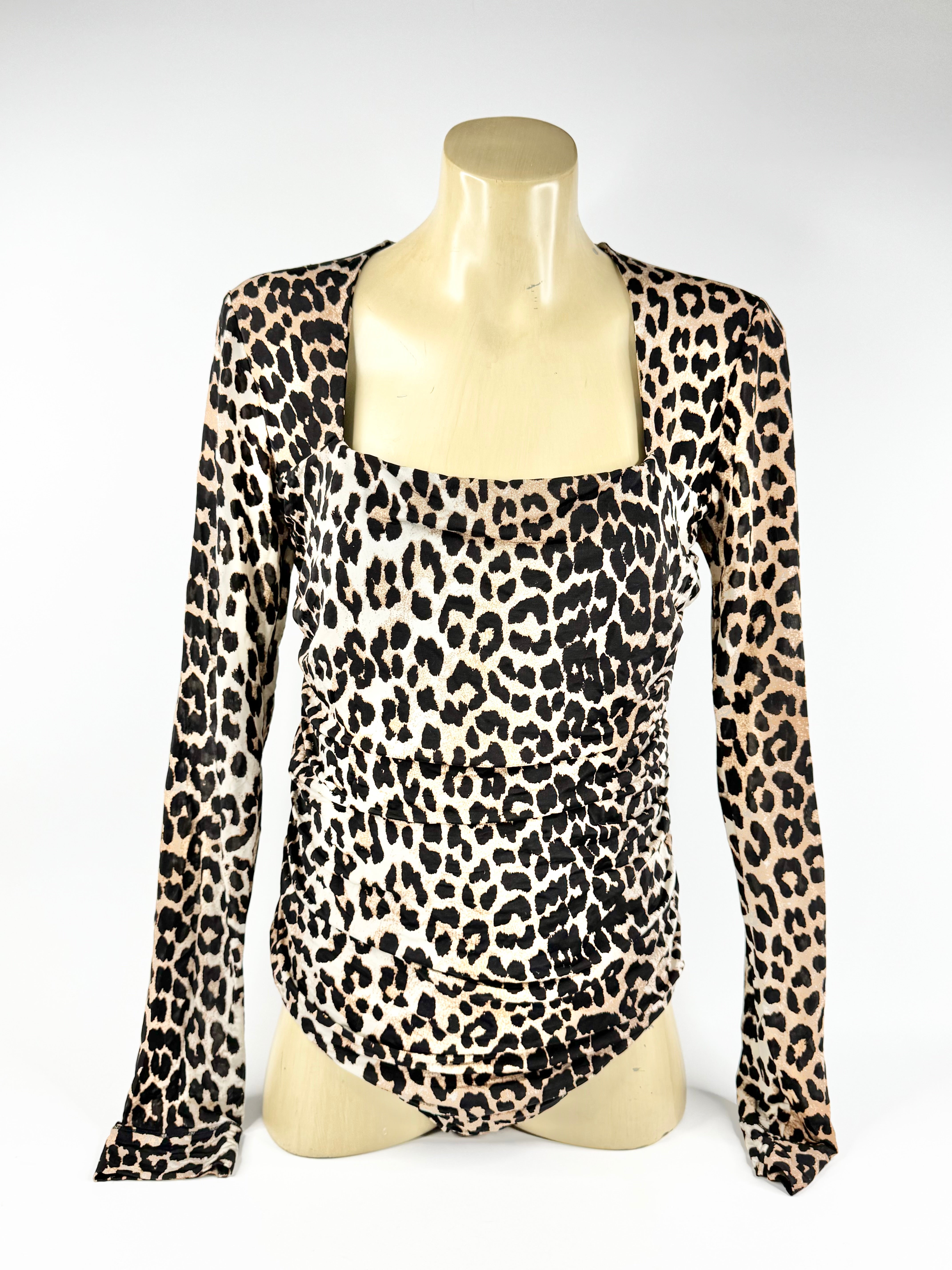 Leopard print long-sleeve top on a mannequin against a white background