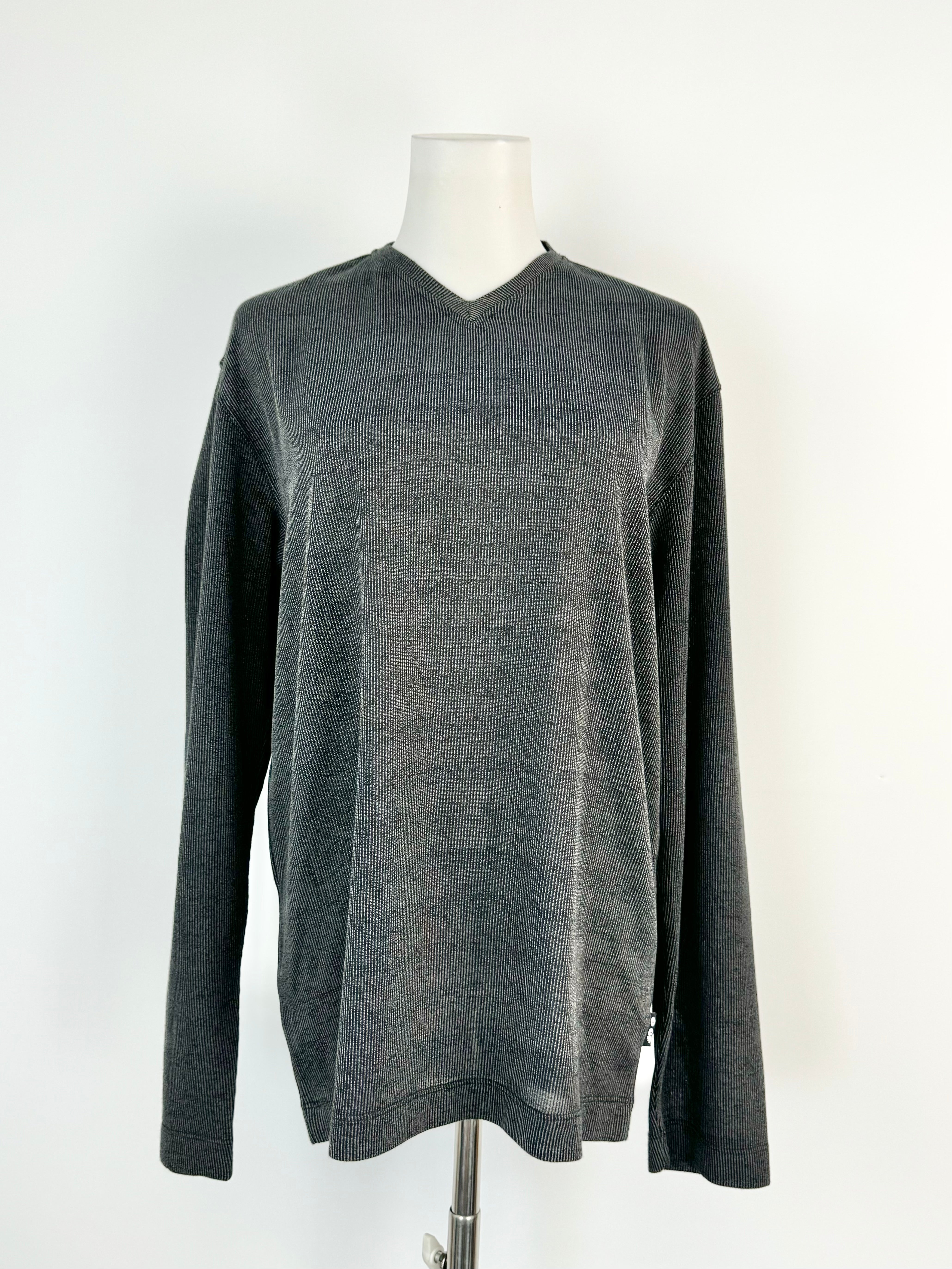 A deep grey long sleeve V-neck top by Gianfranco Ferre displayed on a mannequin.