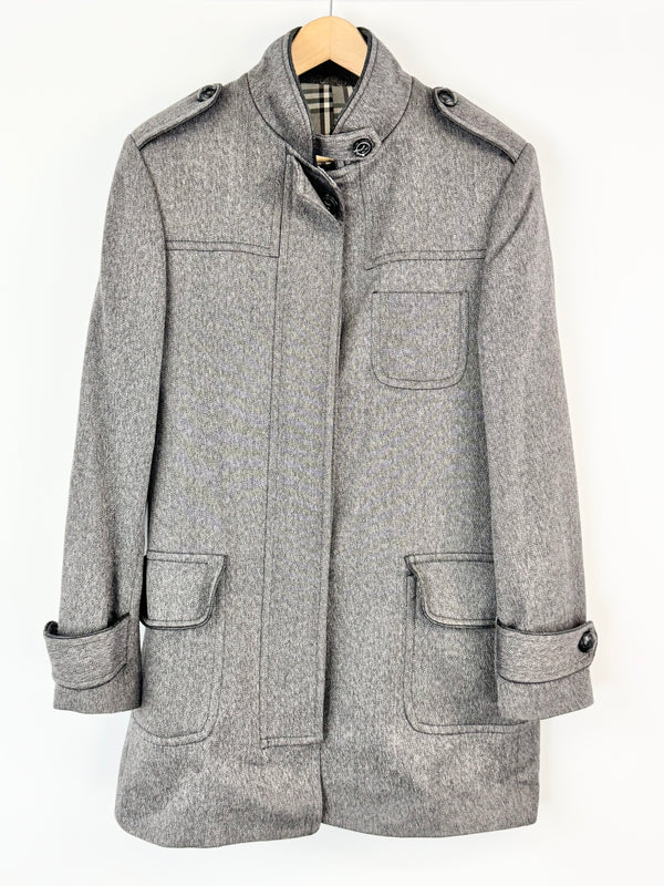 Gray coat on a hanger against a white background